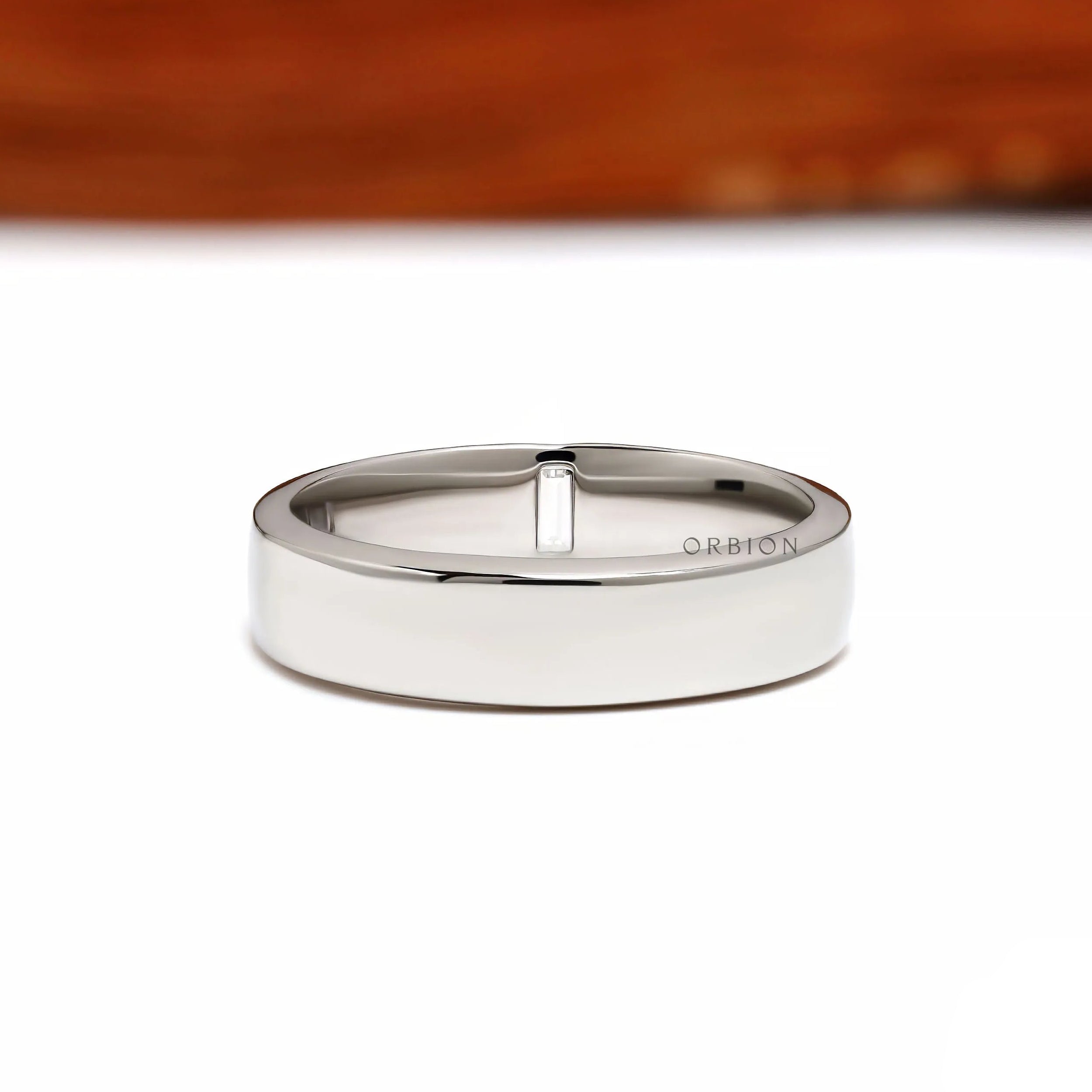 Modern platinum thumb ring for men featuring baguette diamonds and a flat comfort fit band design