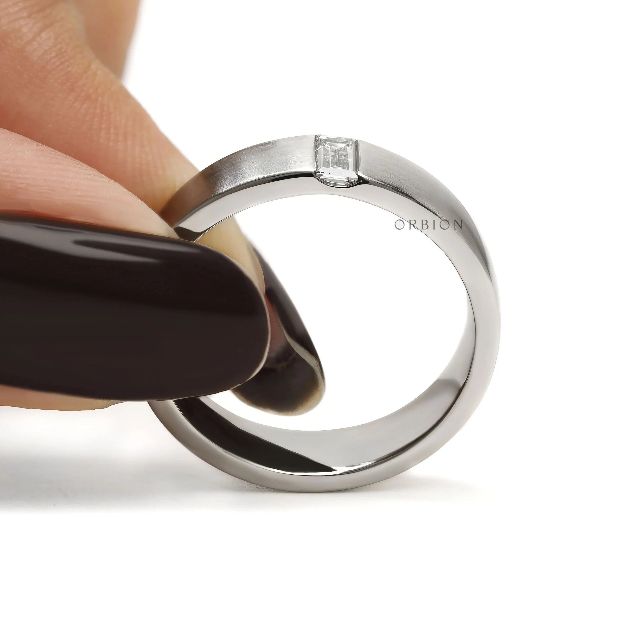 Luxury platinum men’s wedding band with baguette diamond accents and minimalist matte finish 