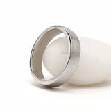 Men’s promise ring in platinum with baguette diamond detailing, matte finish and contemporary thumb ring style