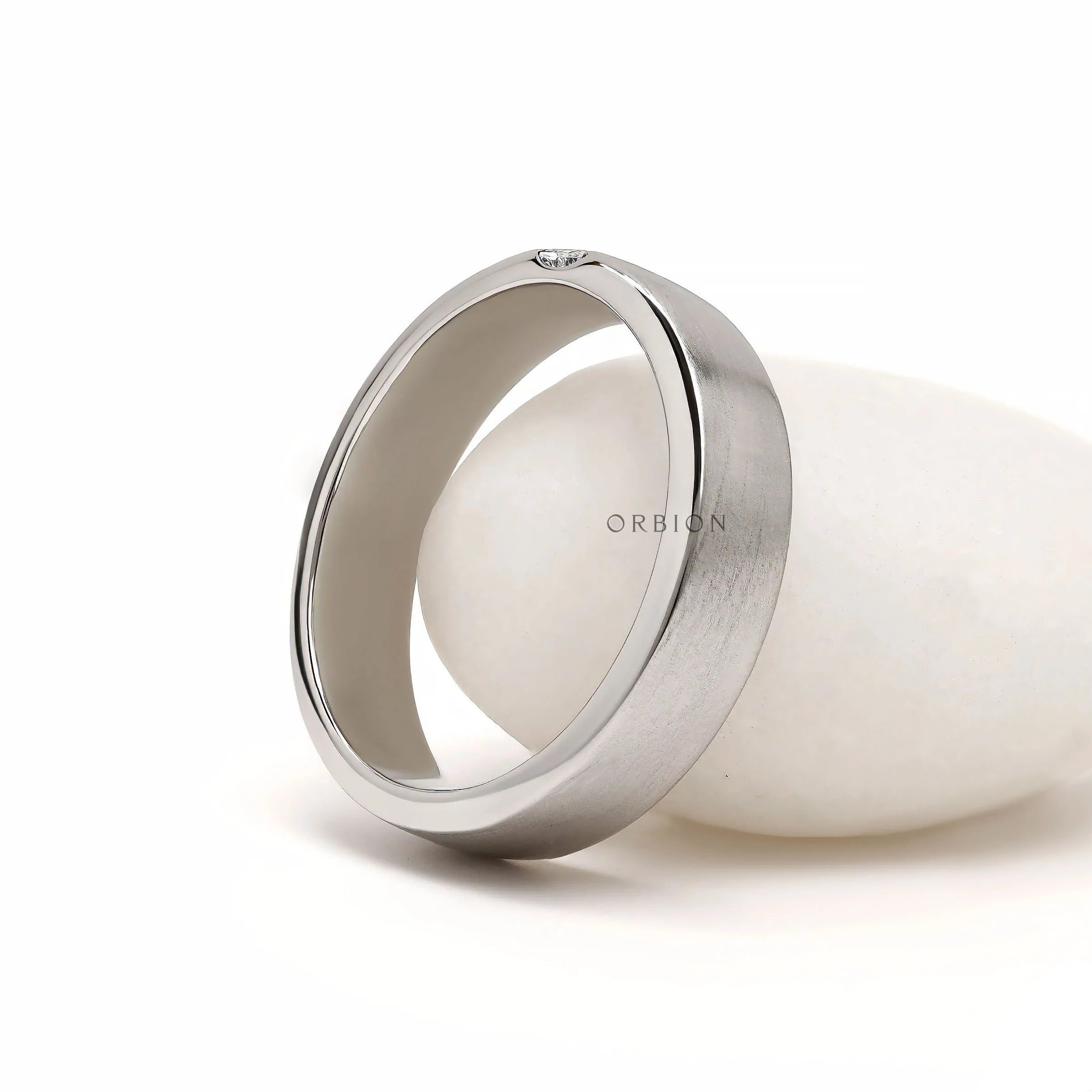 Men’s promise ring in platinum with baguette diamond detailing, matte finish and contemporary thumb ring style