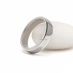 Elegant men’s diamond wedding band with baguette stones, sleek platinum setting, and anniversary ring style