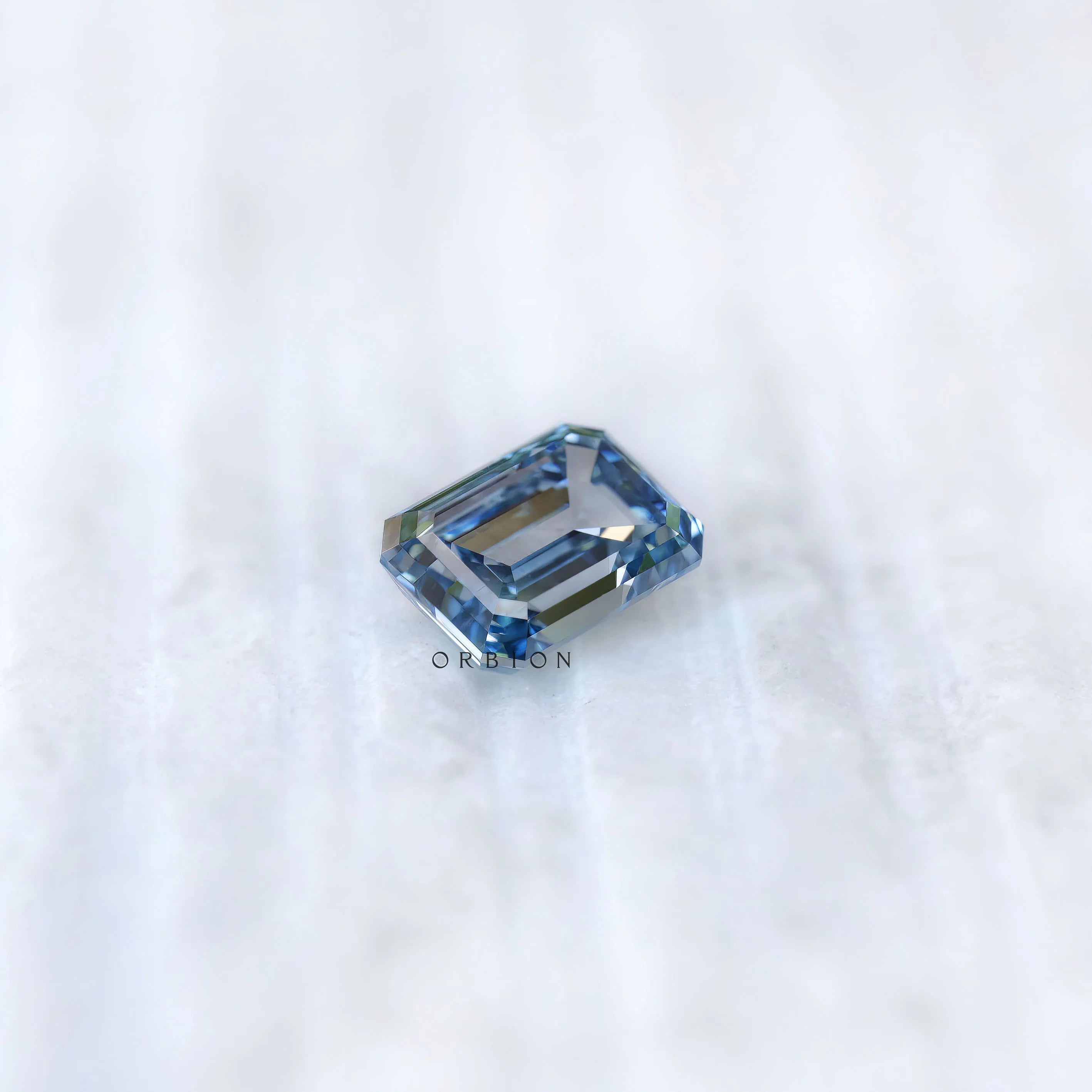 Emerald cut blue lab grown diamond 3 ct with deep color tone