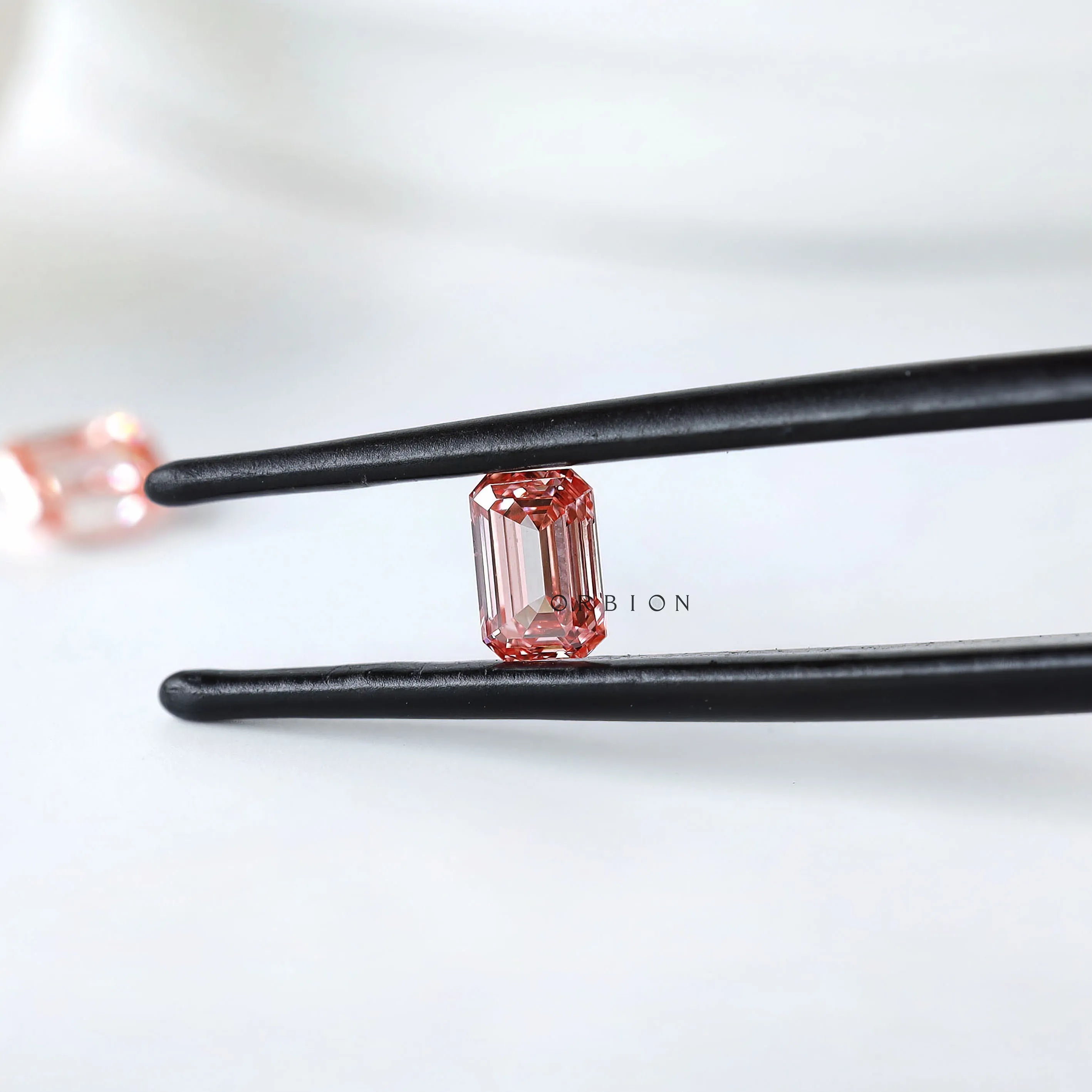 Pair of pink lab diamonds in emerald shape for bespoke earrings