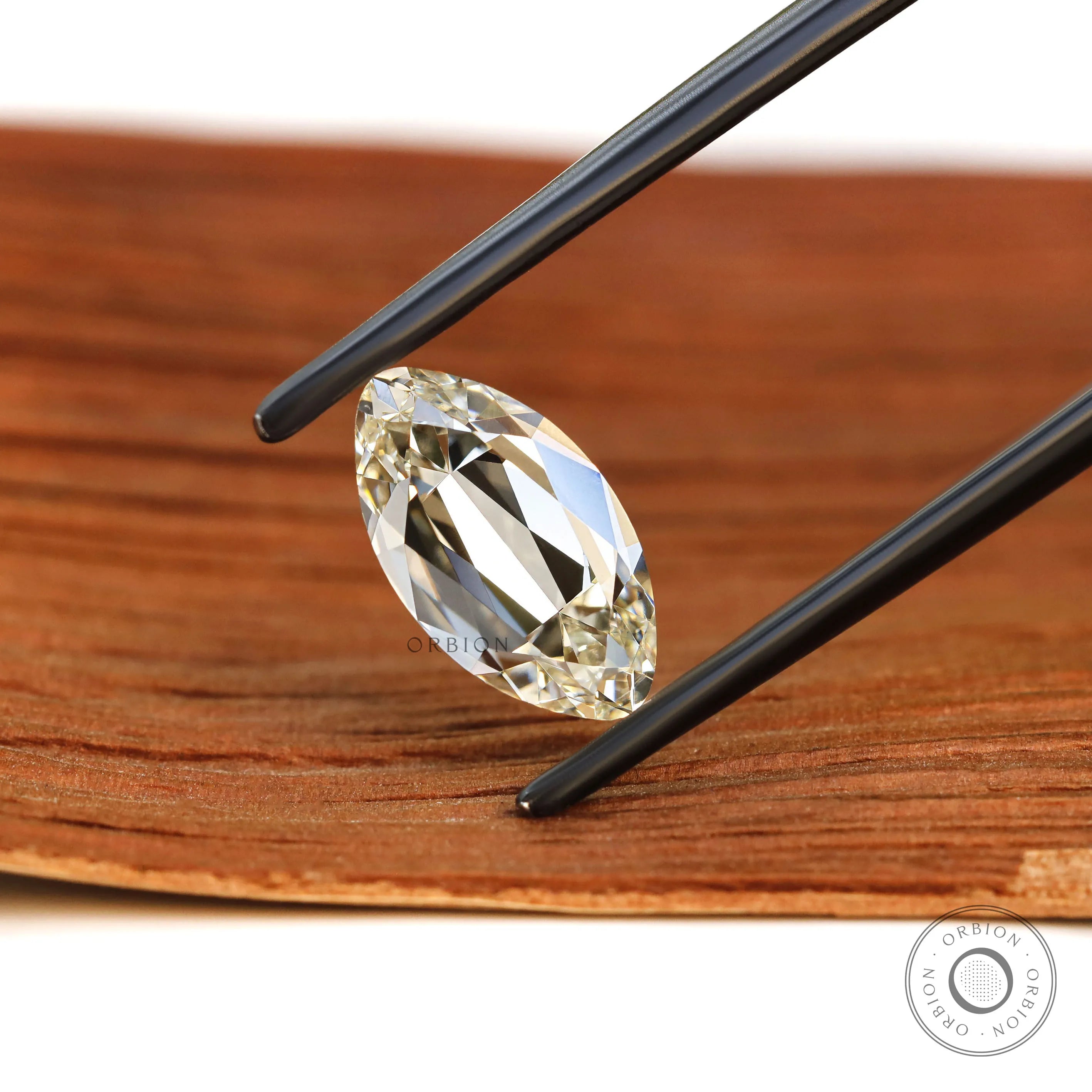 Moval shape lab diamond 2 ct featuring warm antique style cut