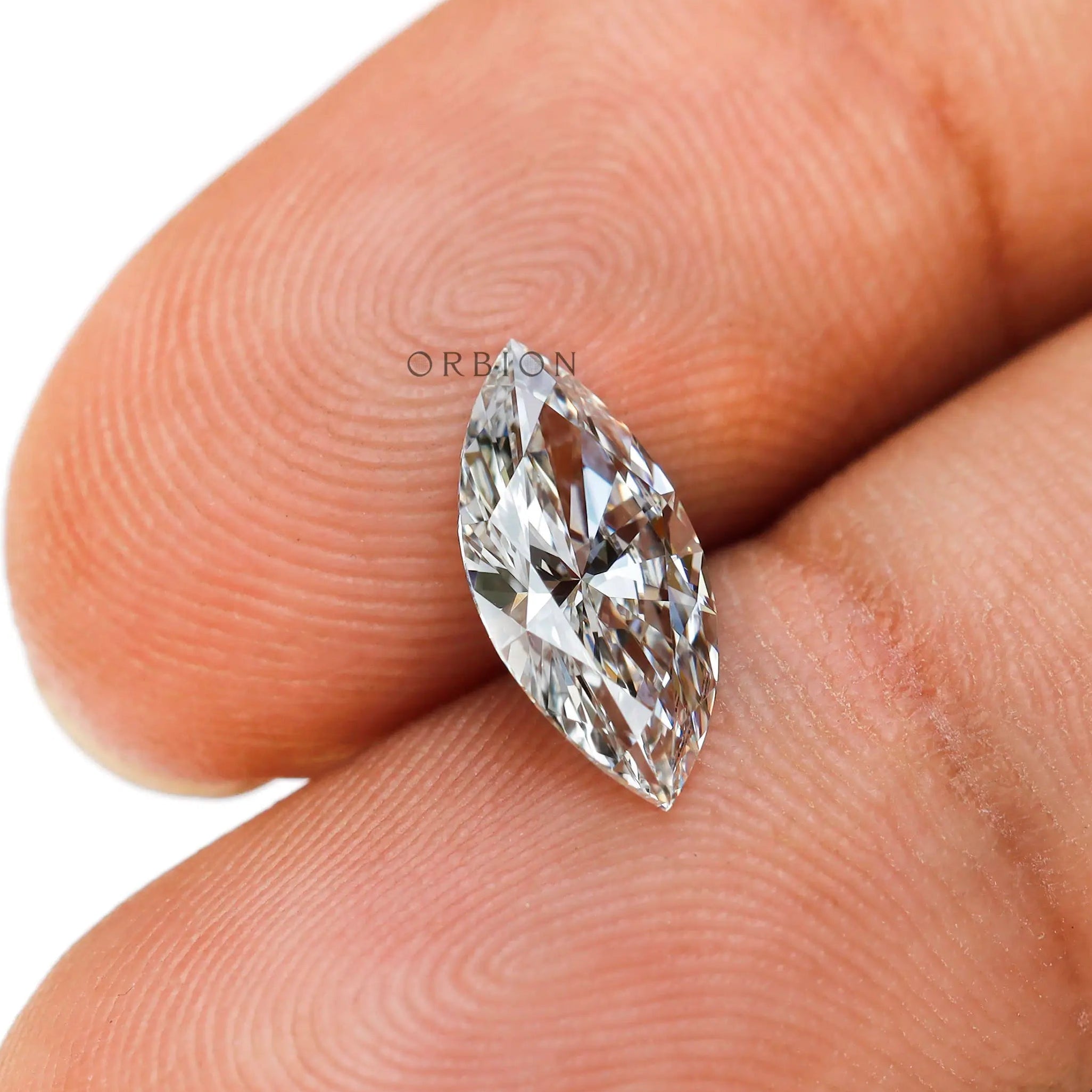1 carat marquise shaped lab grown diamond in hand