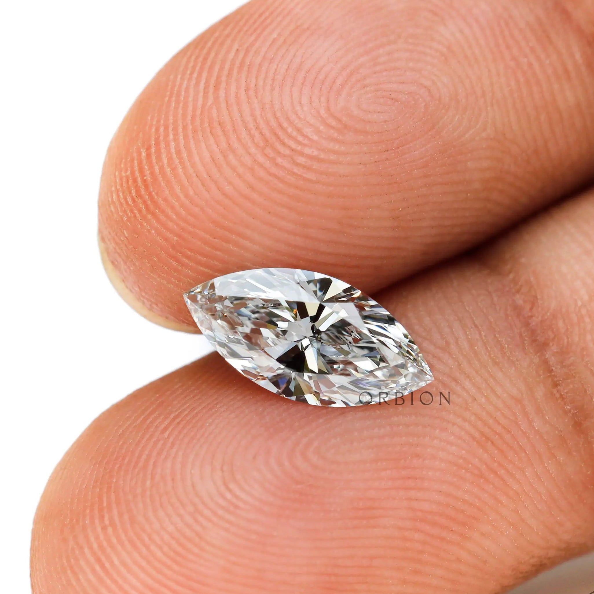 Loose marquise gemstone in hand