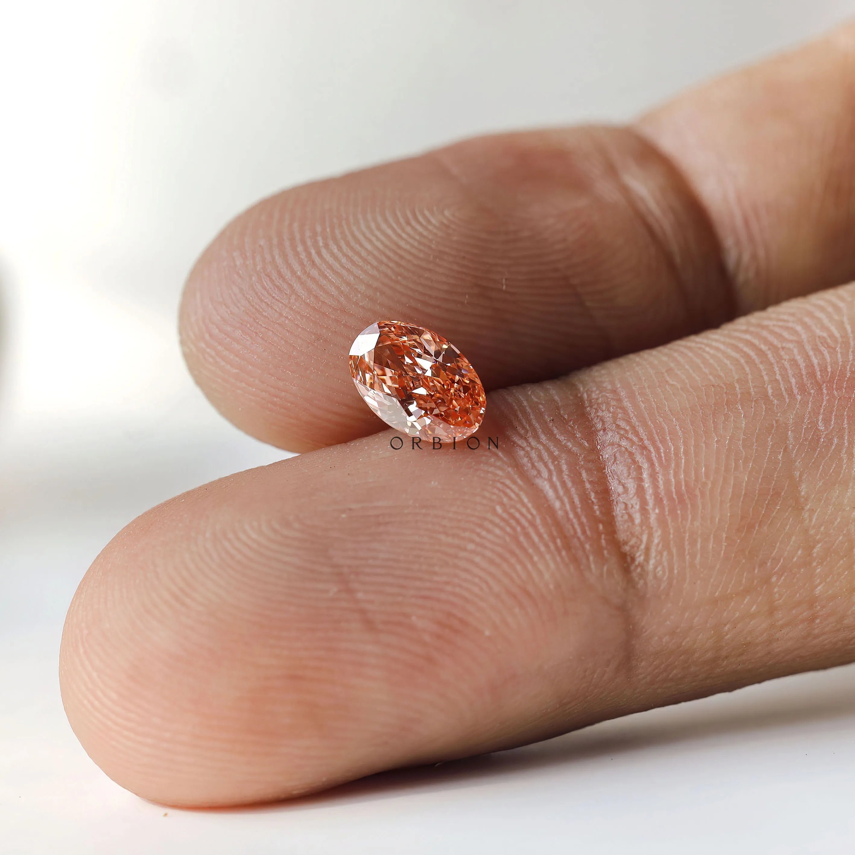 0.73 ct Oval shaped lab diamond with bold pink color tone