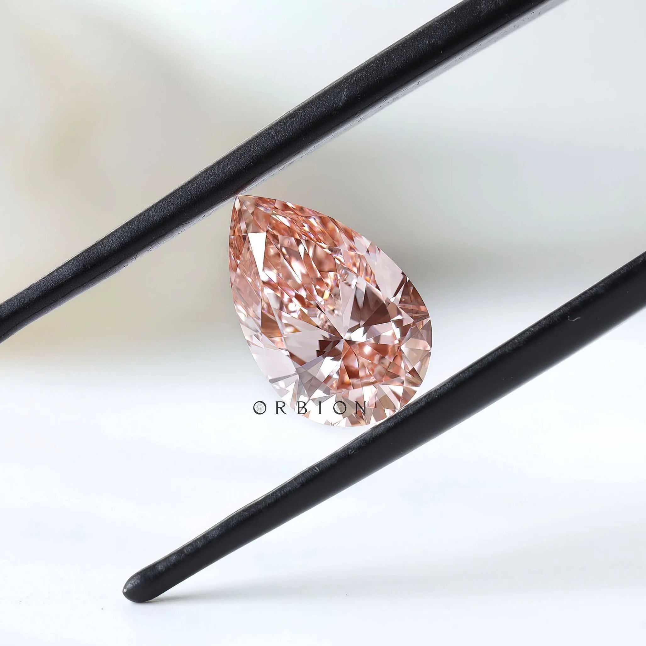 2 ct Pear shaped lab diamond with vivid orangy pink color