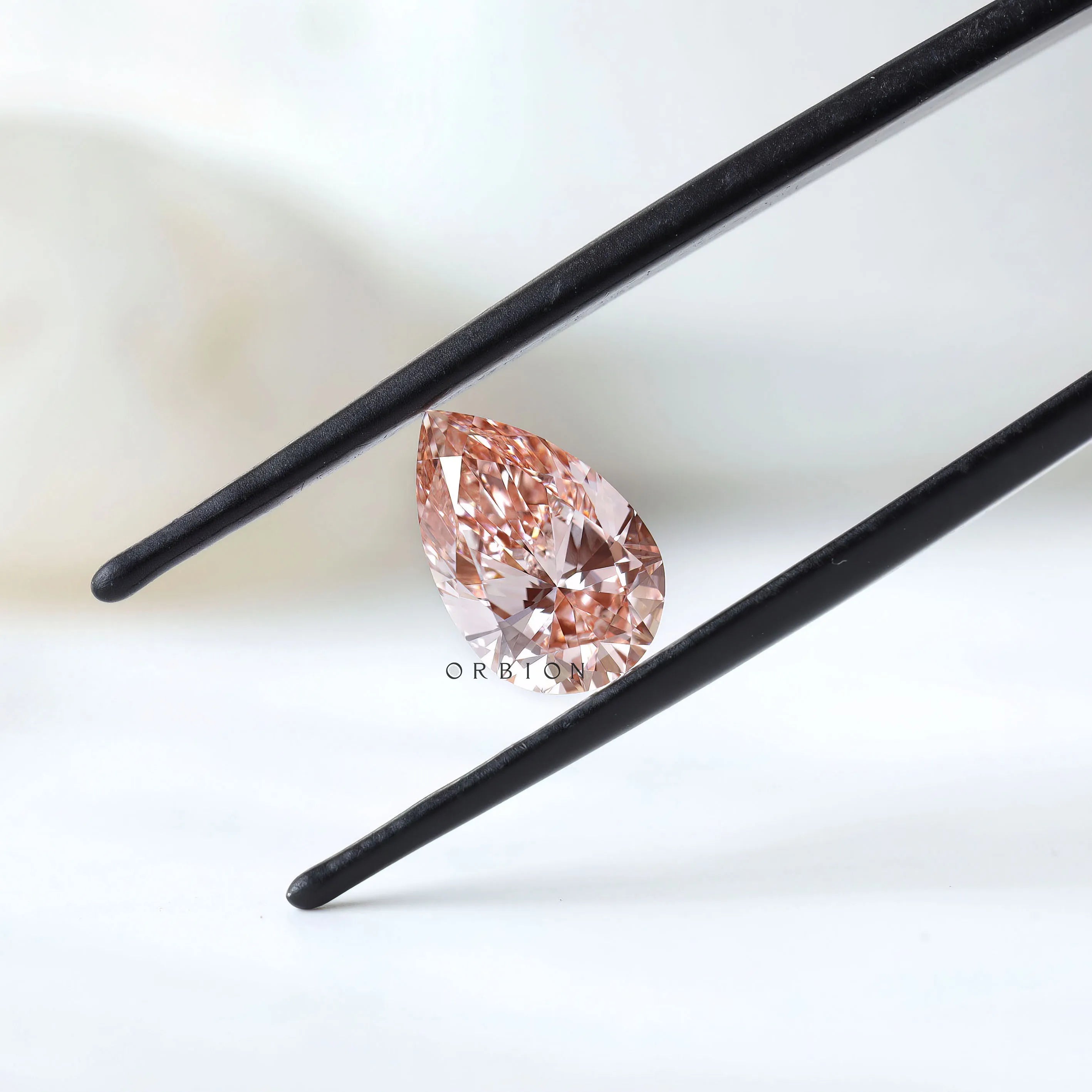 2 ct Pear shaped lab diamond with vivid orangy pink color