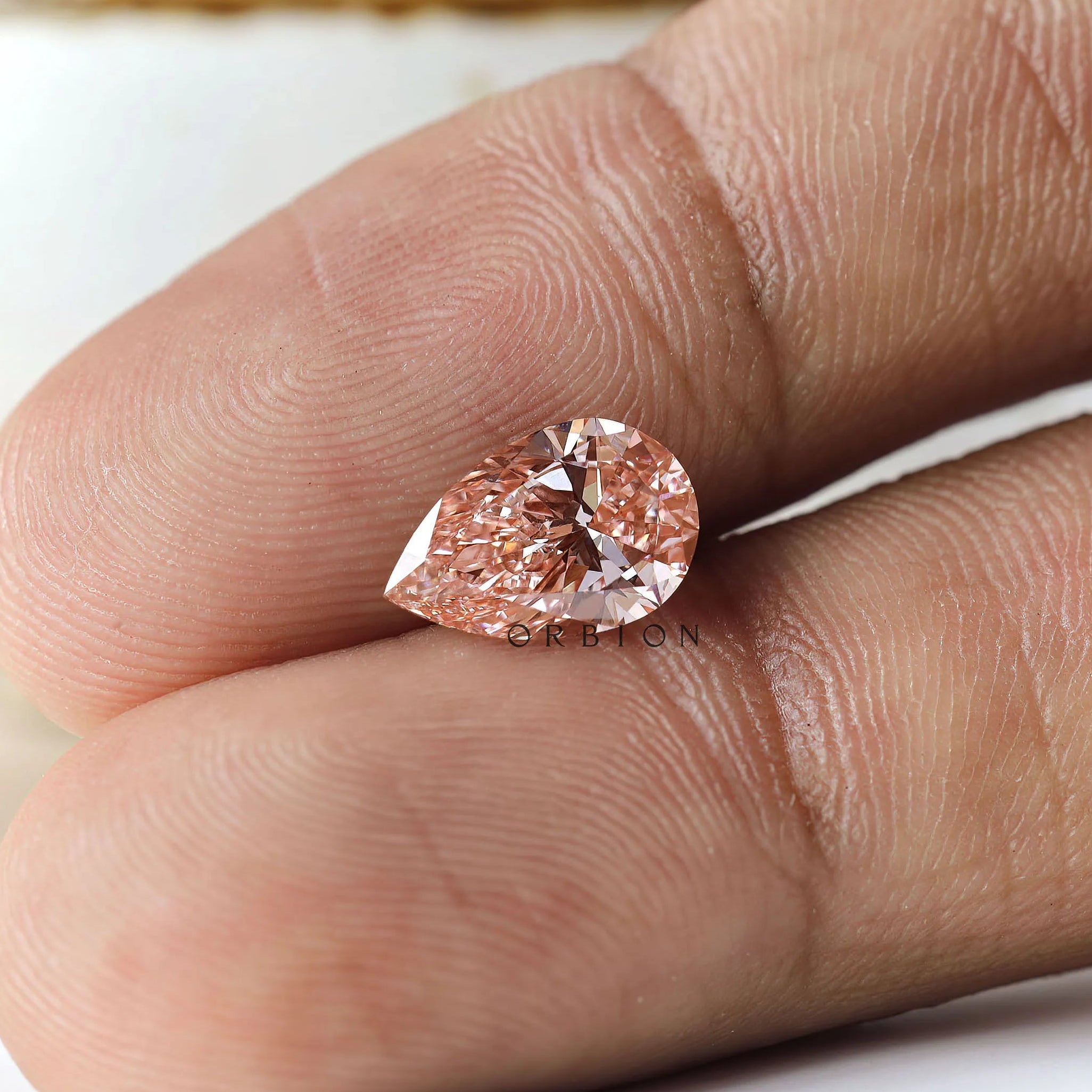 2 ct Pear lab diamond with vibrant orangy pink color tone