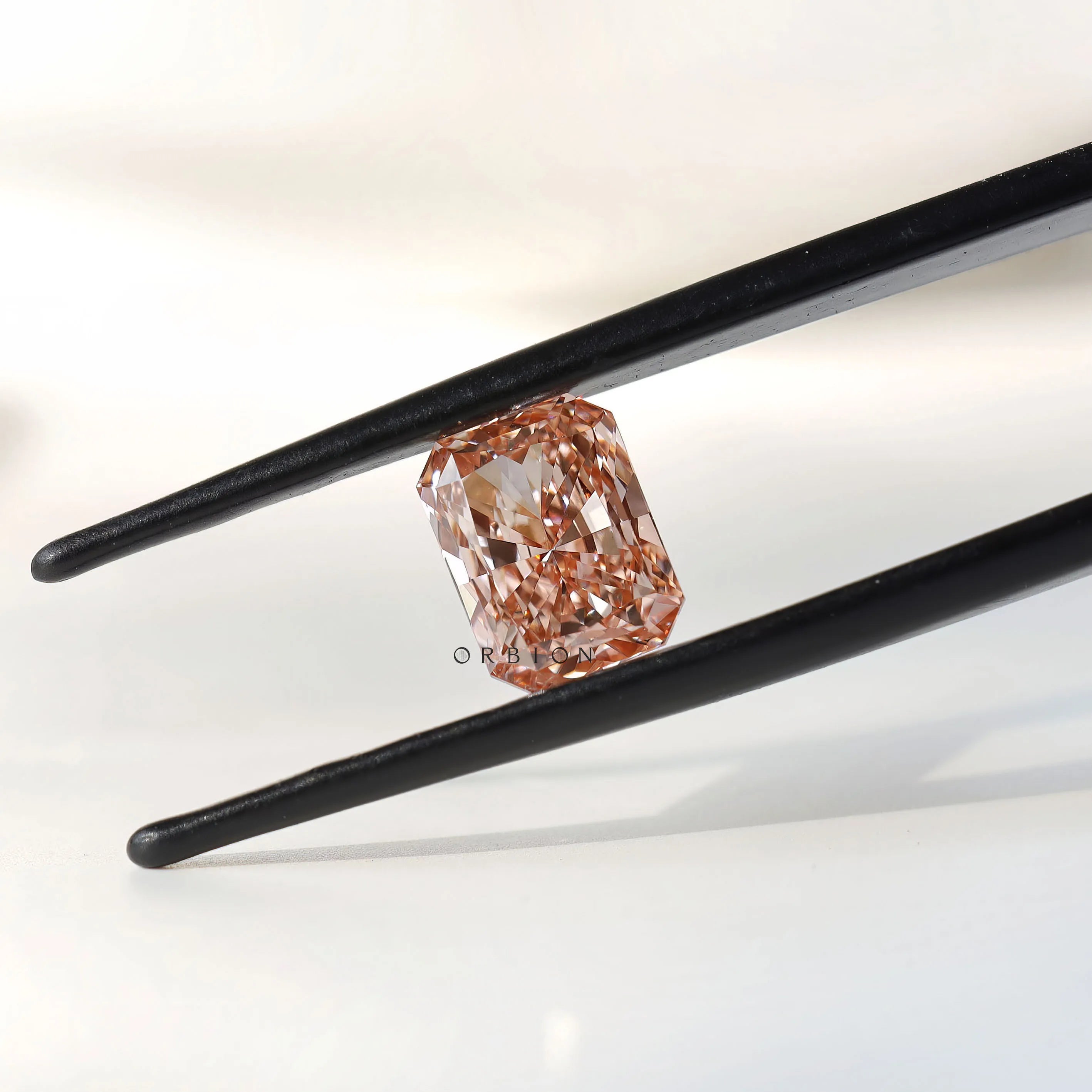 2 ct Radiant cut lab diamond with warm orangey pink color