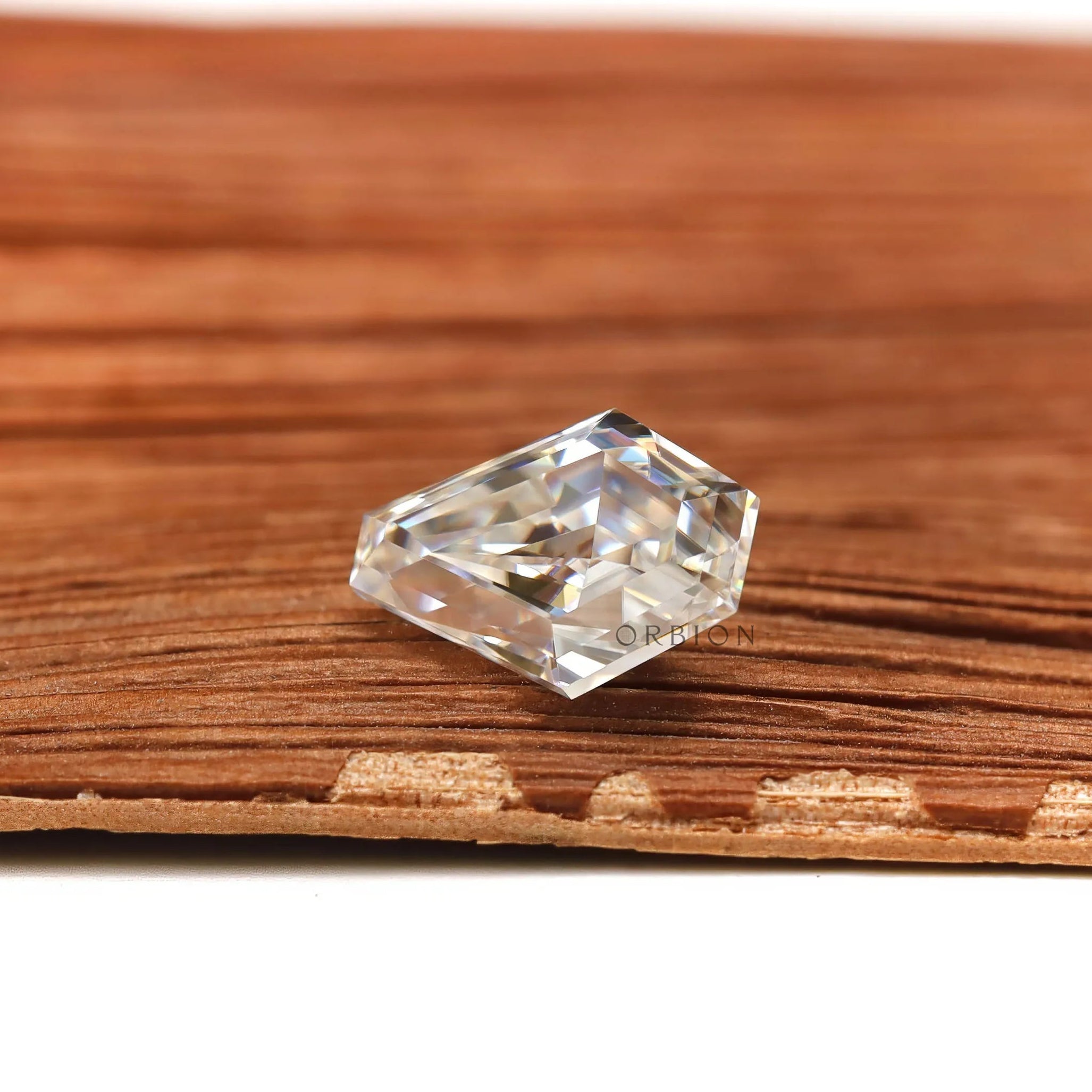 Colorless coffin shaped moissanite gemstone with step cut design
