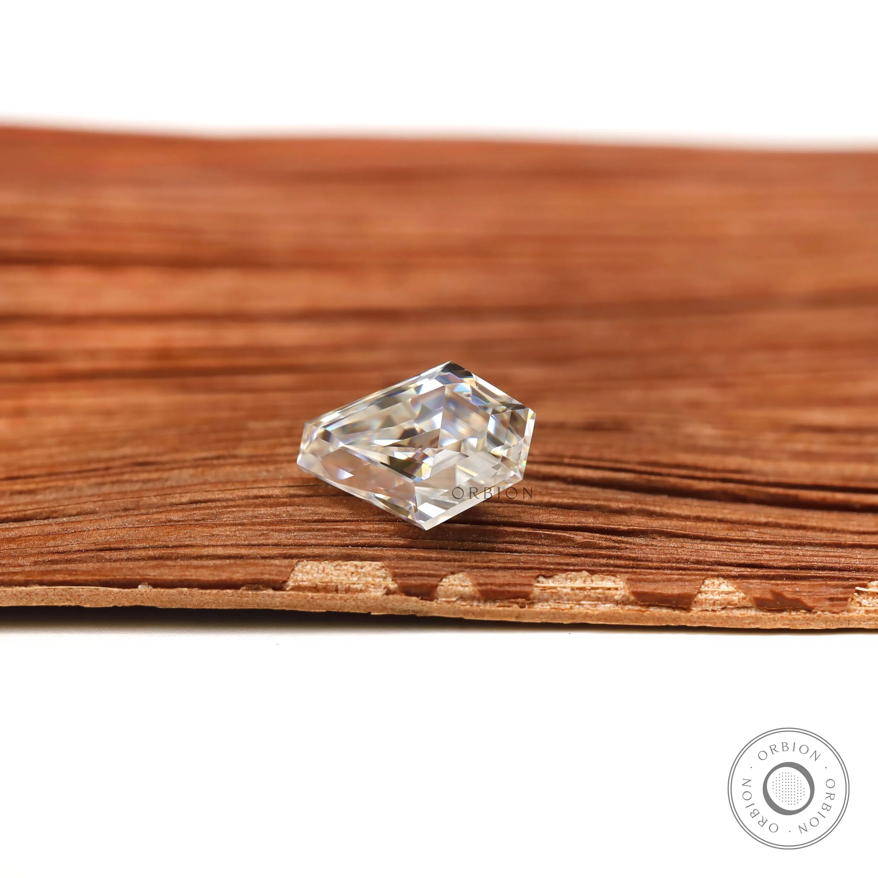 Colorless coffin shaped moissanite gemstone with step cut design