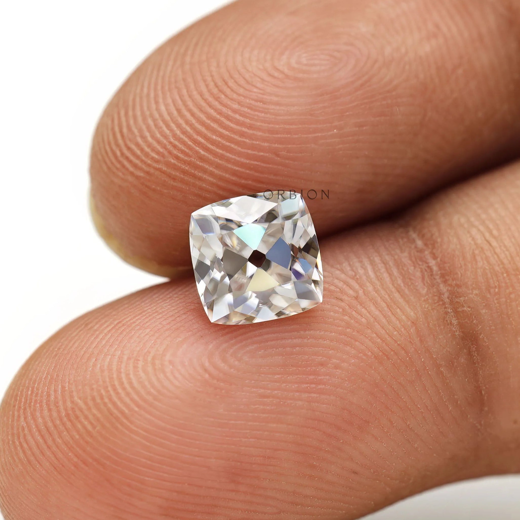 Close view of cushion Peruzzi moissanite brilliance