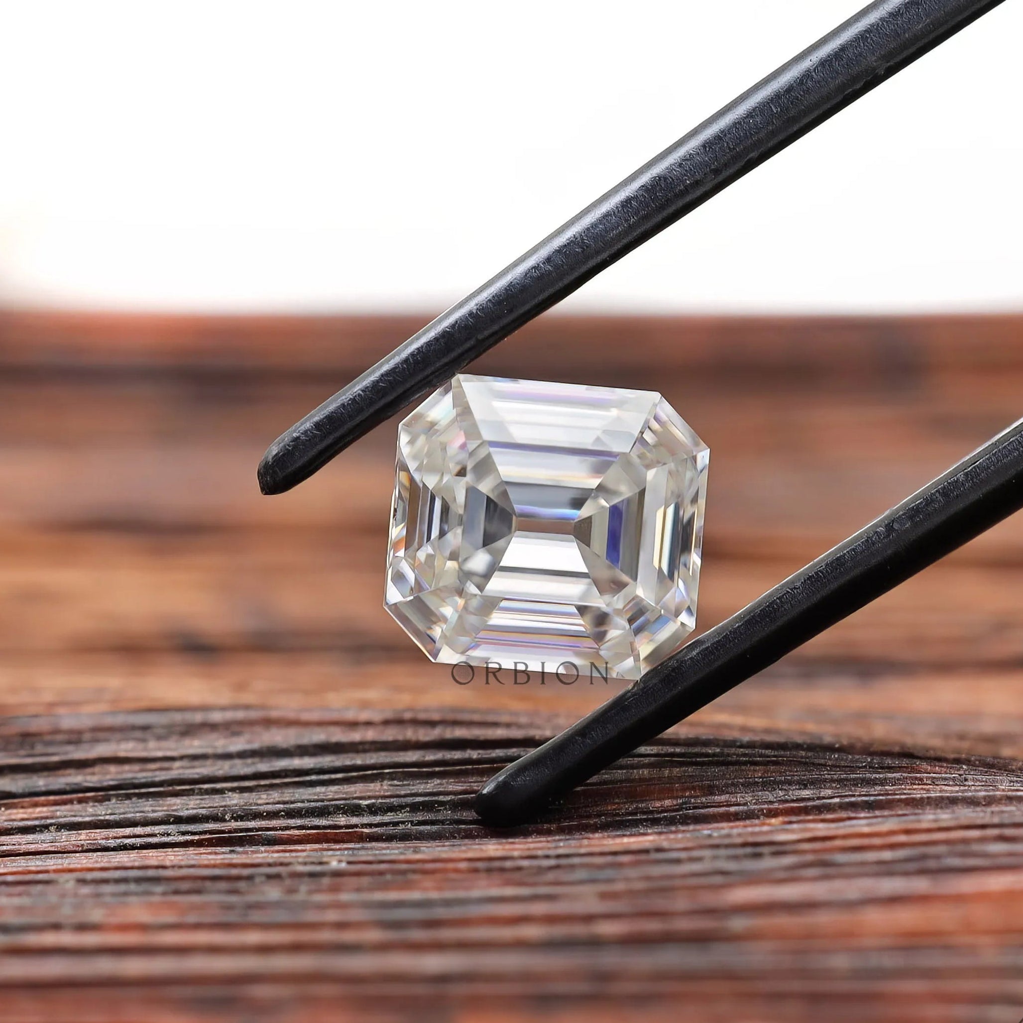 Elongated asscher cut moissanite with open culet clear color stone