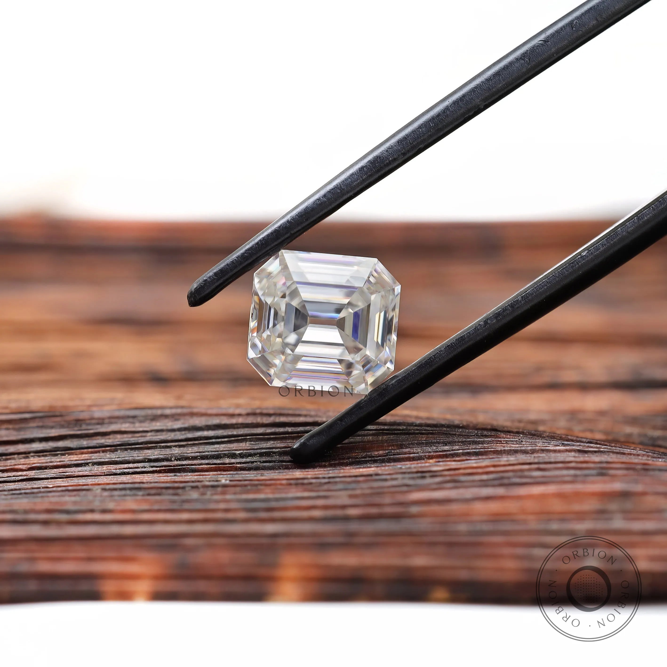 Elongated asscher cut moissanite with open culet clear color stone