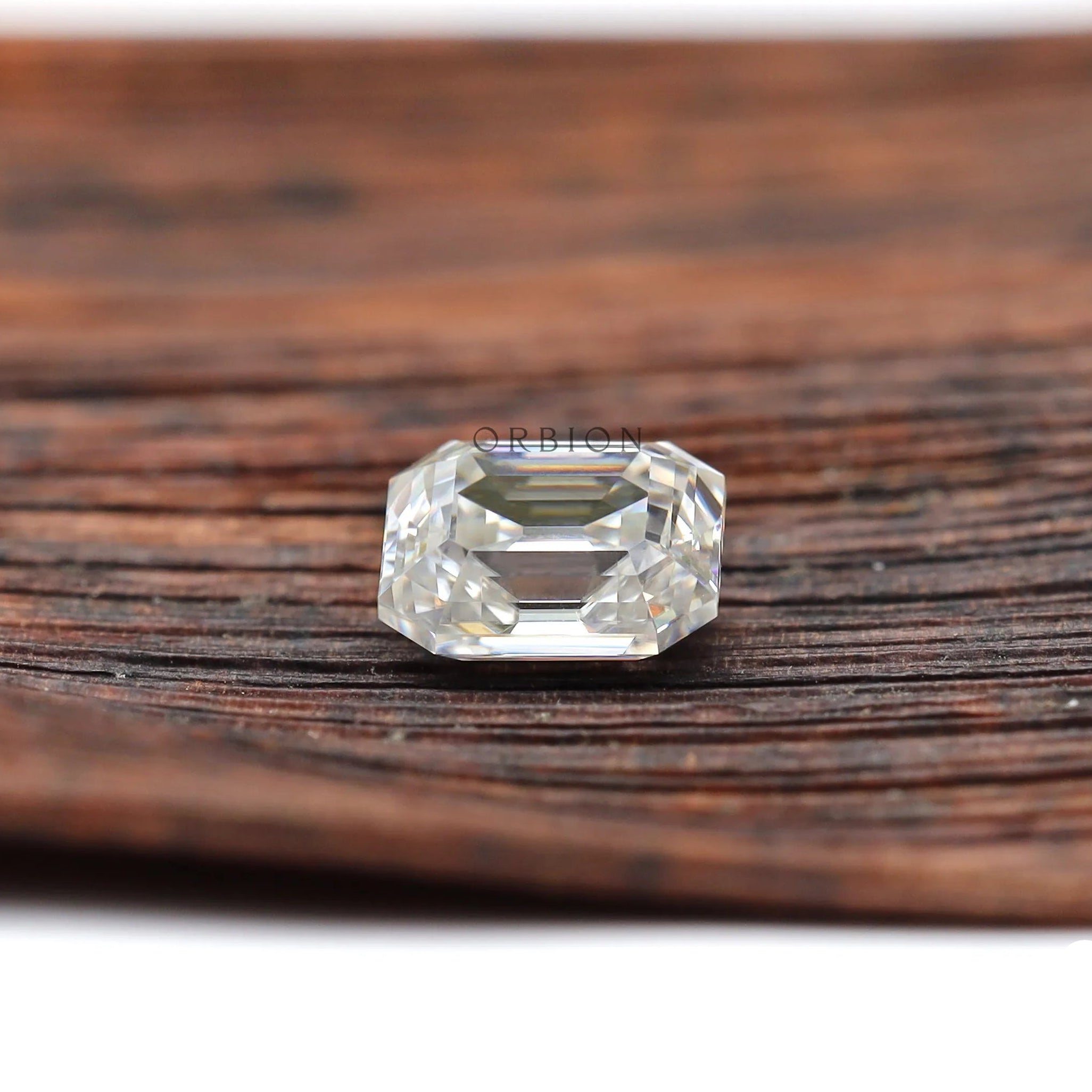 Colorless moissanite elongated asscher shape with visible open culet