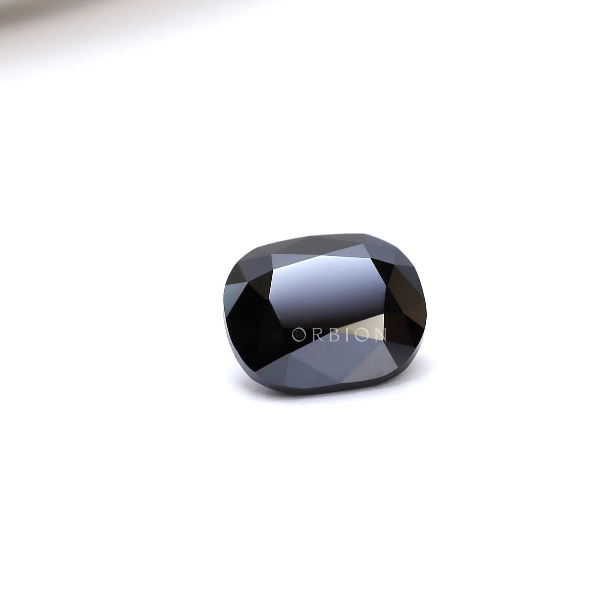 1.2 ct Elongated cushion moissanite in deep black tone old mine cut