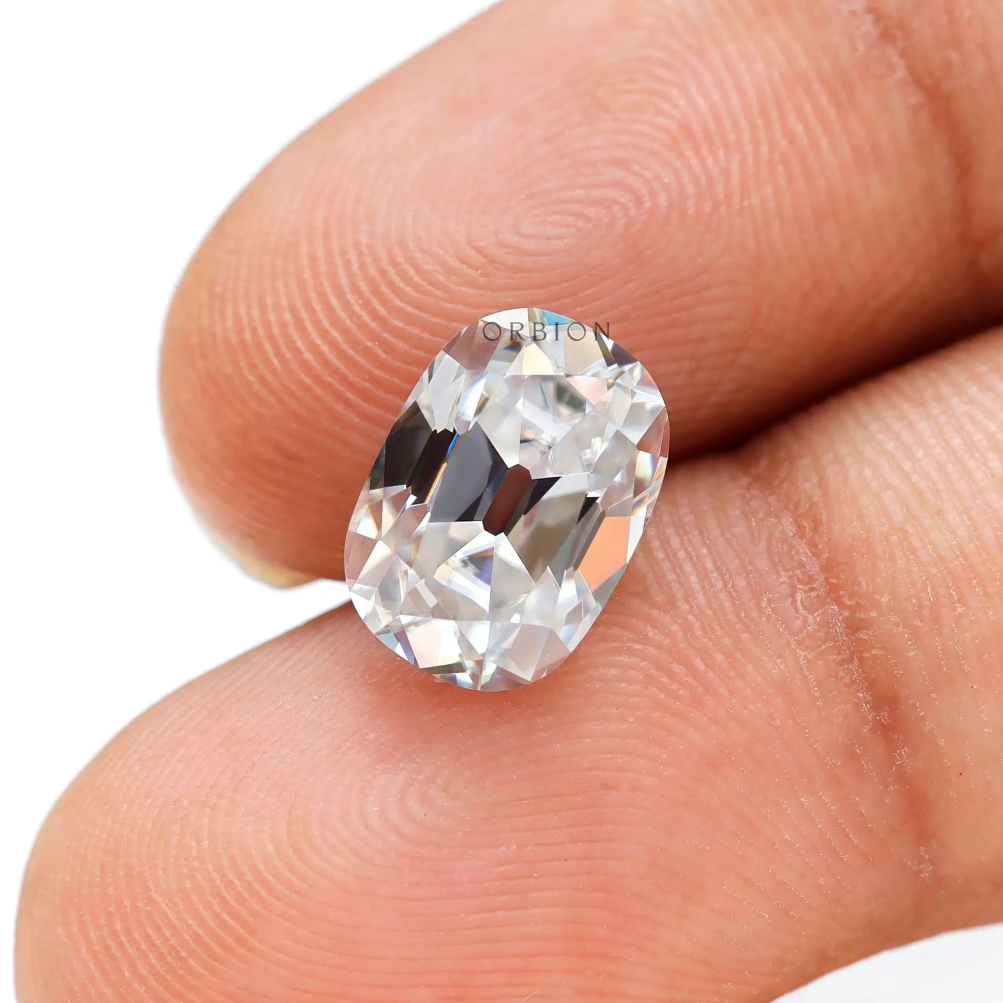Colorless cushion stone in hand