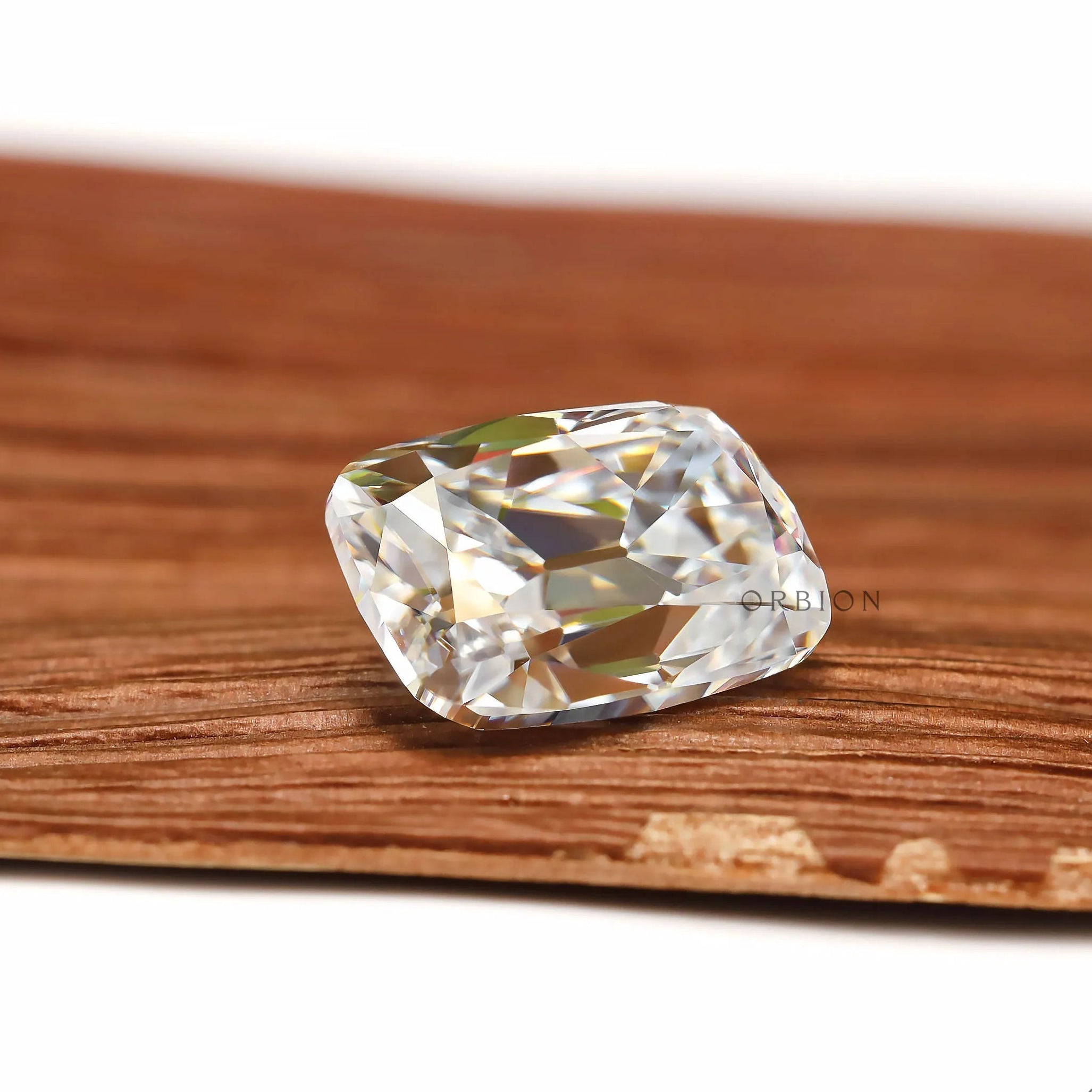 Colorless moissanite elongated cushion with antique faceting