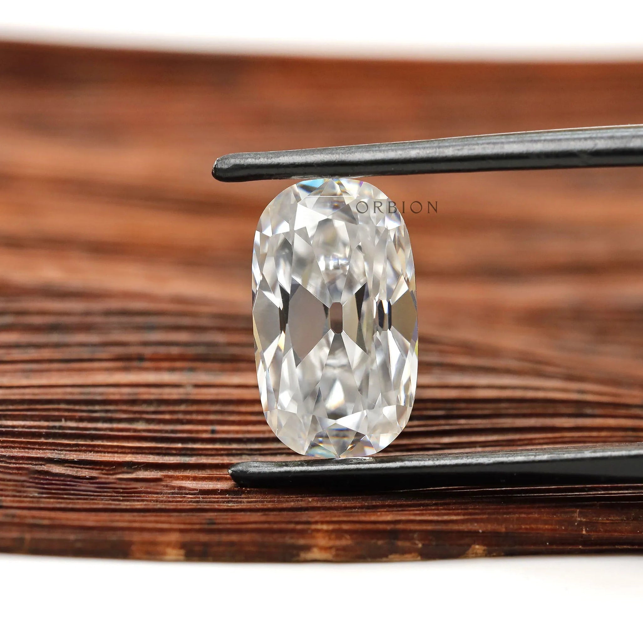 Colorless elongated cushion moissanite with antique old mine cut