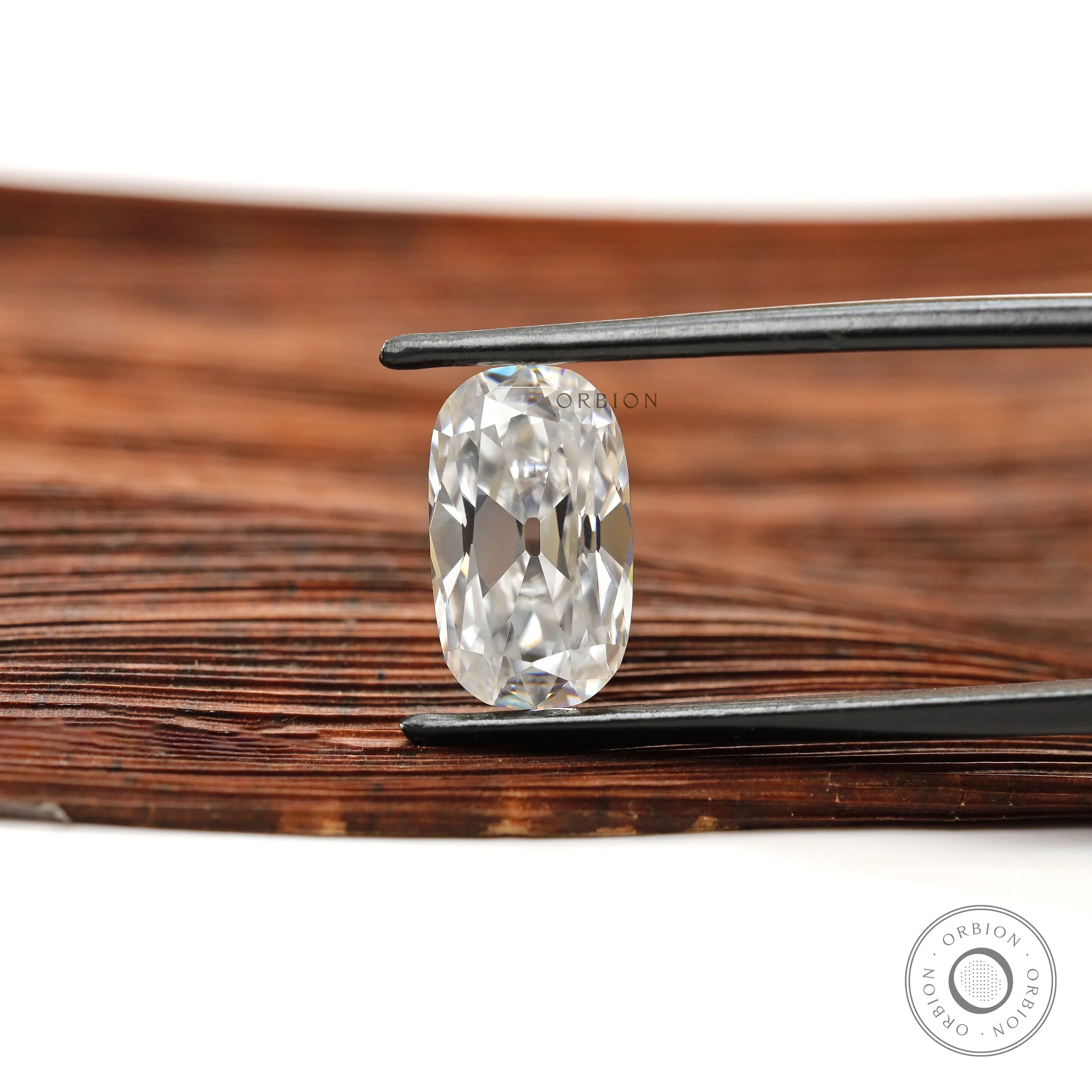 Colorless elongated cushion moissanite with antique old mine cut
