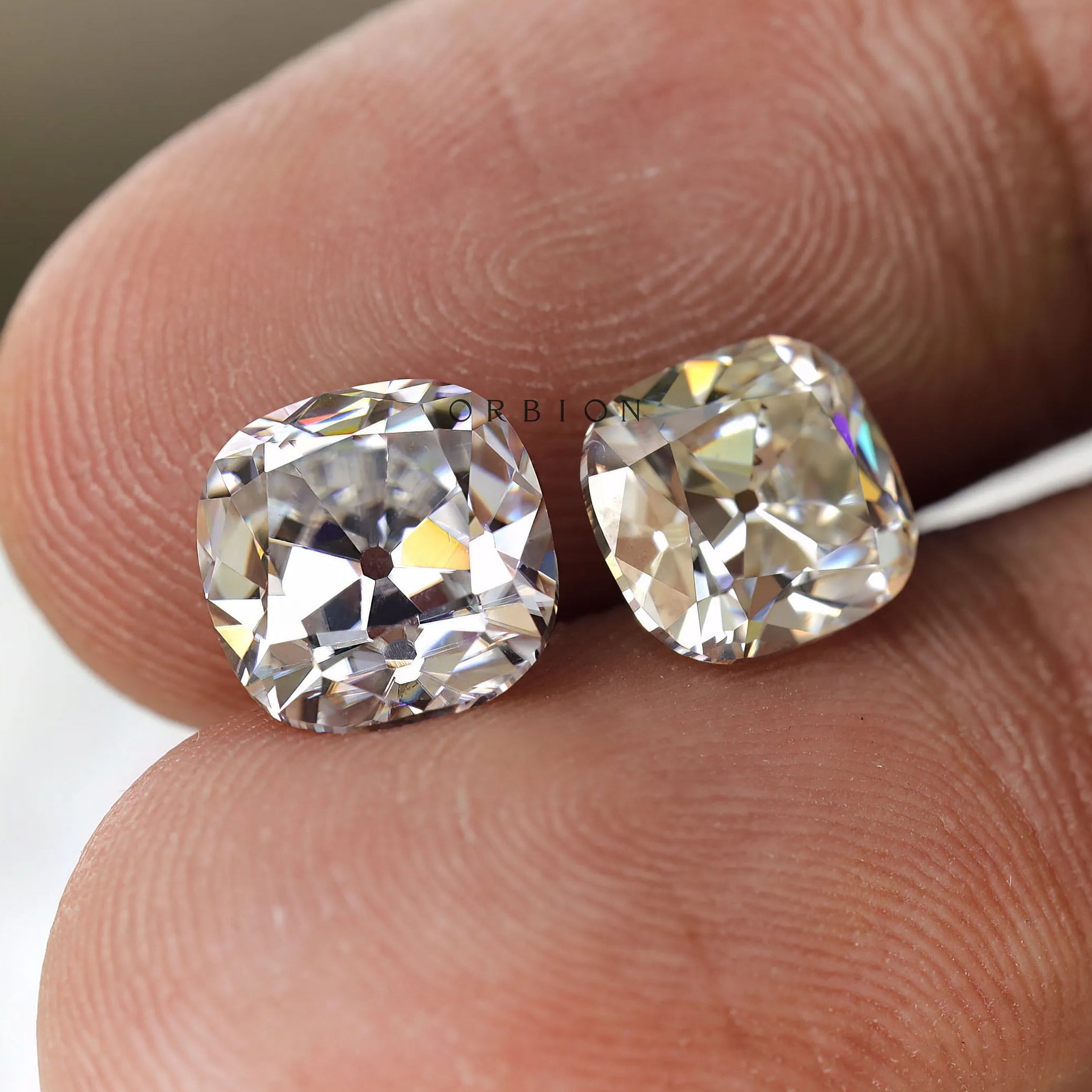 Colorless moissanite gemstone, elongated cushion shape, old mine faceting