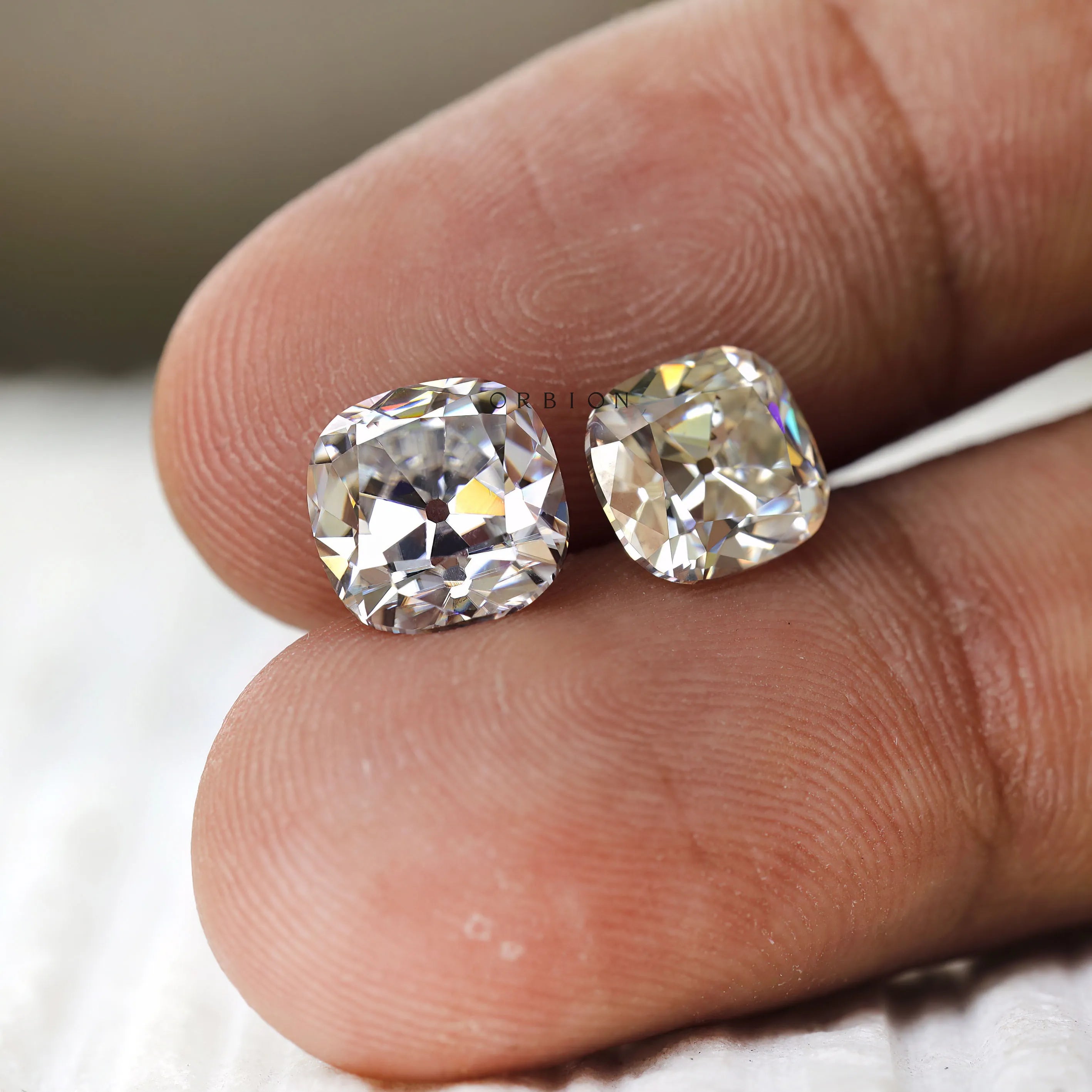 Colorless moissanite gemstone, elongated cushion shape, old mine faceting