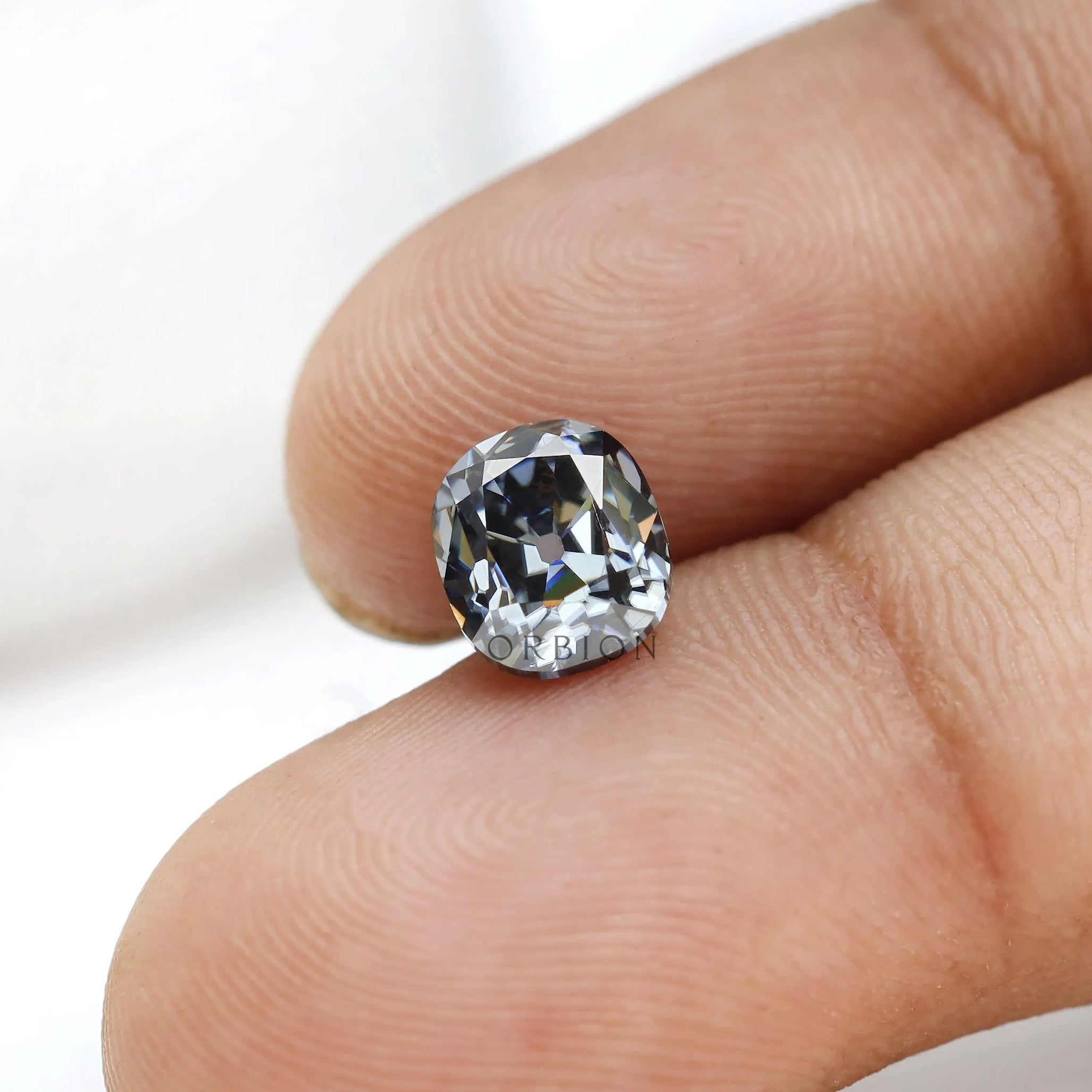1.20 ct Elongated cushion moissanite with vintage brilliance in grey shade
