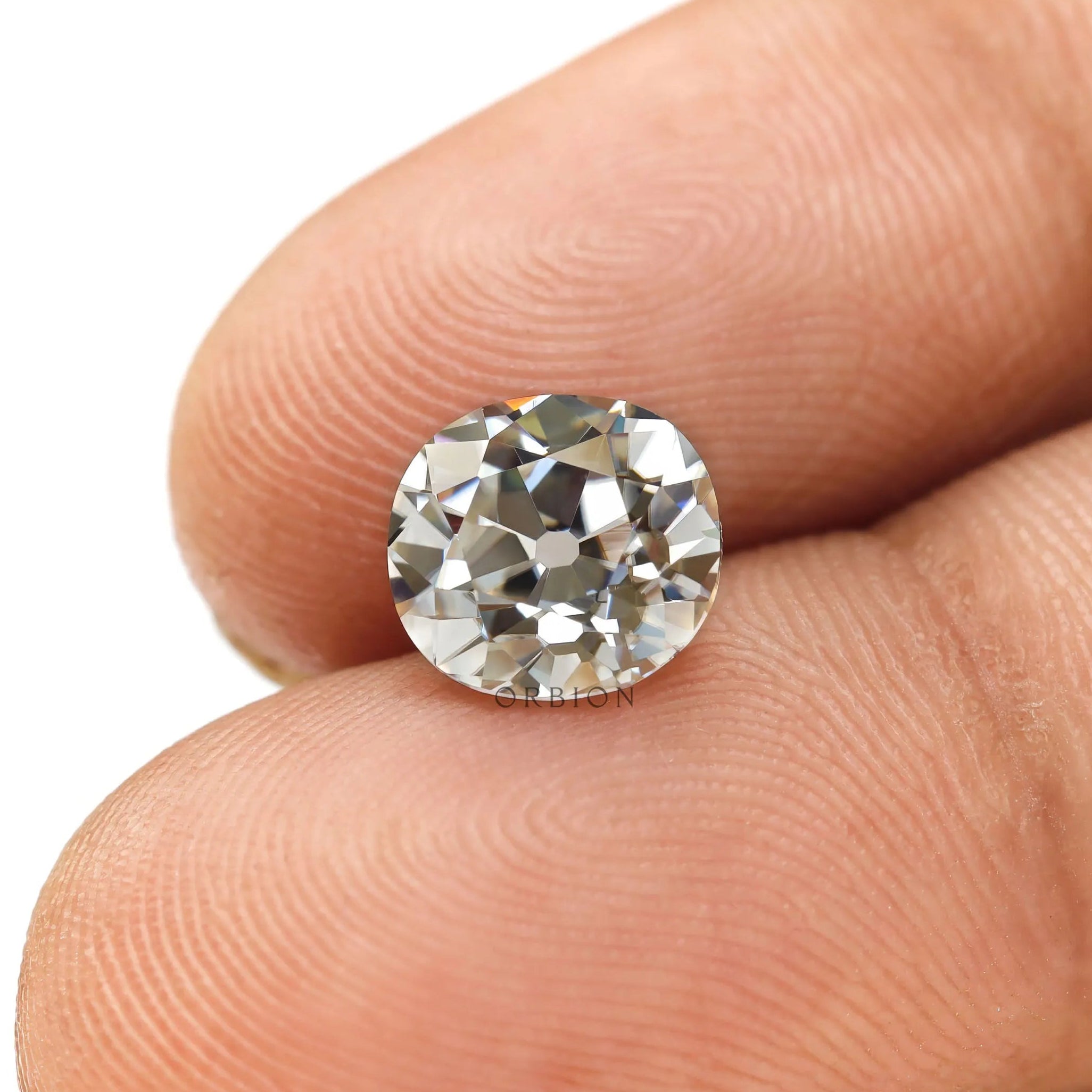 Old mine cut elongated cushion off white moissanite