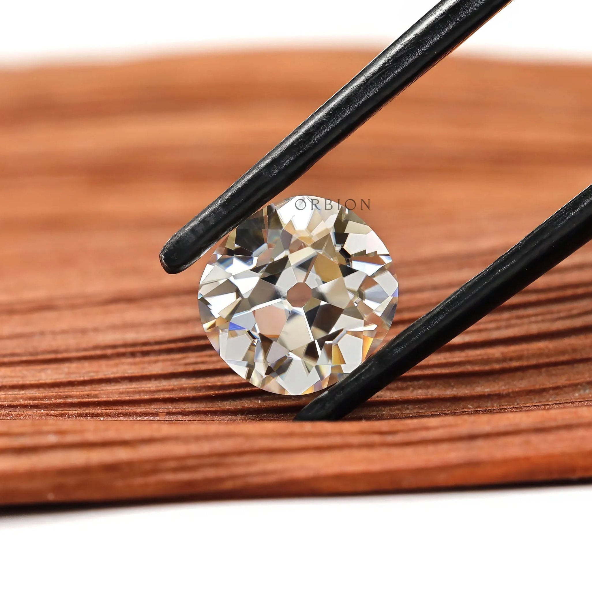 Elongated cushion moissanite 2.40 ct in soft off white tone with antique cut