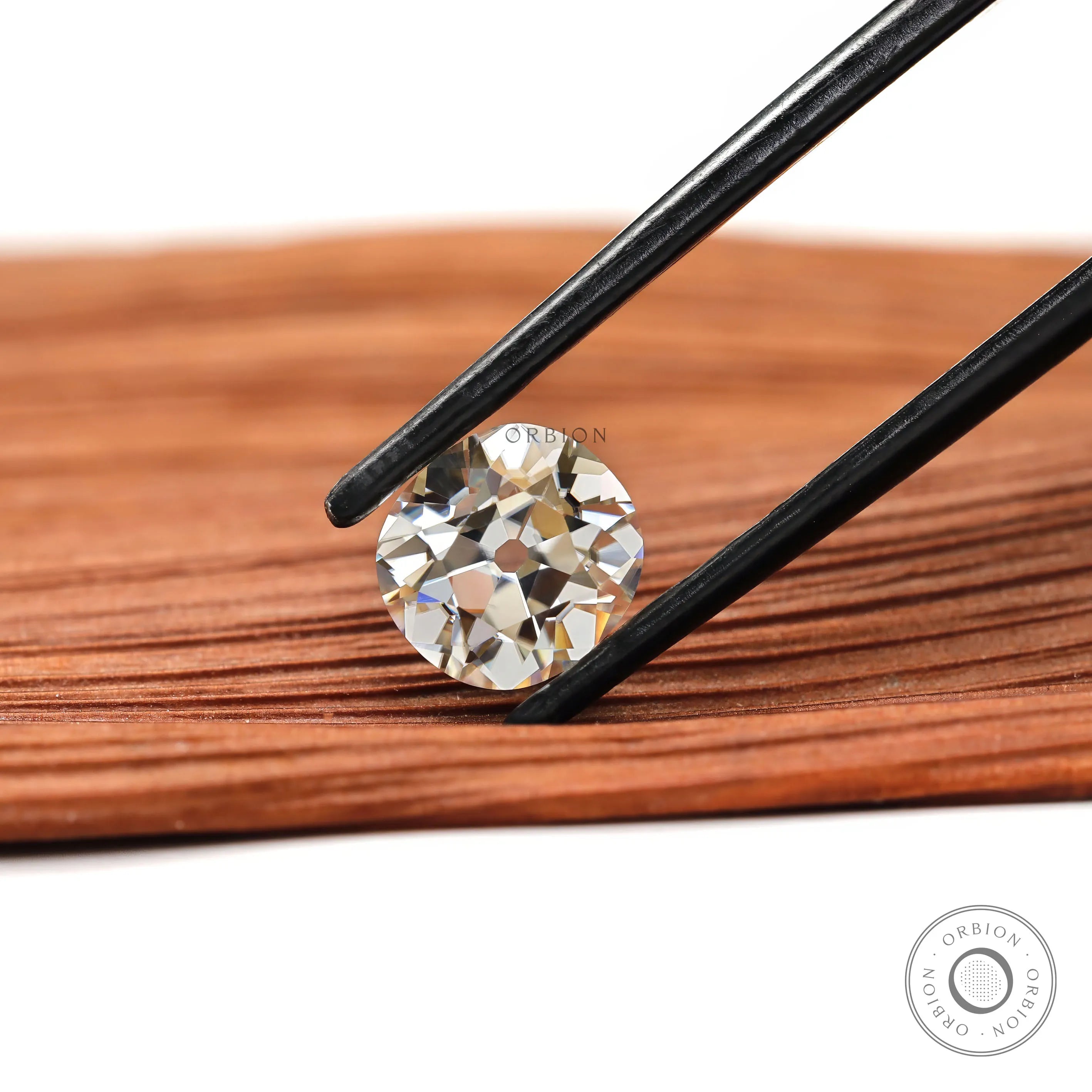 Elongated cushion moissanite 2.40 ct in soft off white tone with antique cut