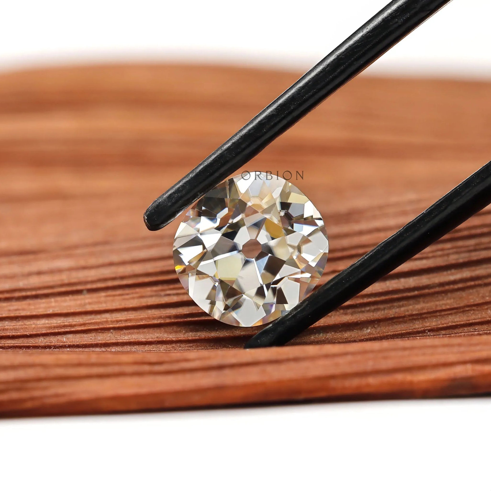 2.40 ct off white moissanite with vintage elongated cushion faceting