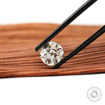 Loose elongated cushion gemstone with warm tint and antique finish
