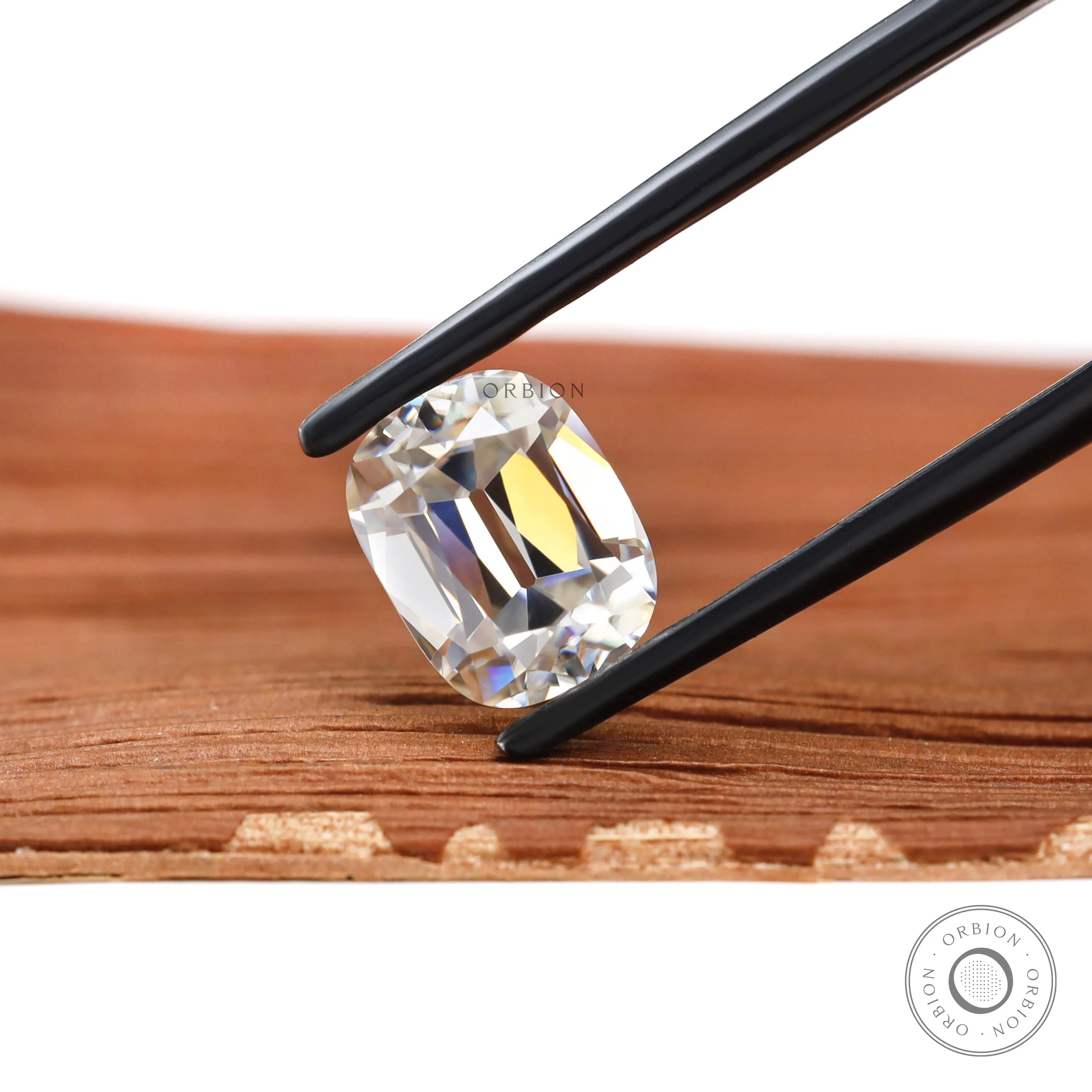 Moissanite Elongated Cushion Stone Old Mine Cut GHI Color VVS Clarity Held by Tweezers