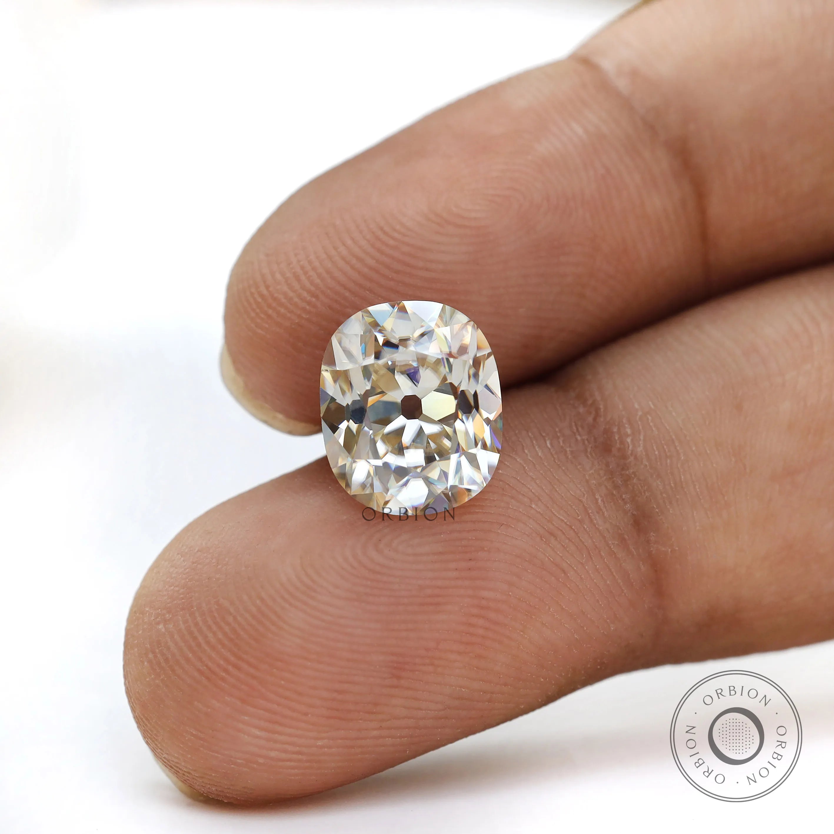 3 ct elongated cushion moissanite off white tone with old mine faceting