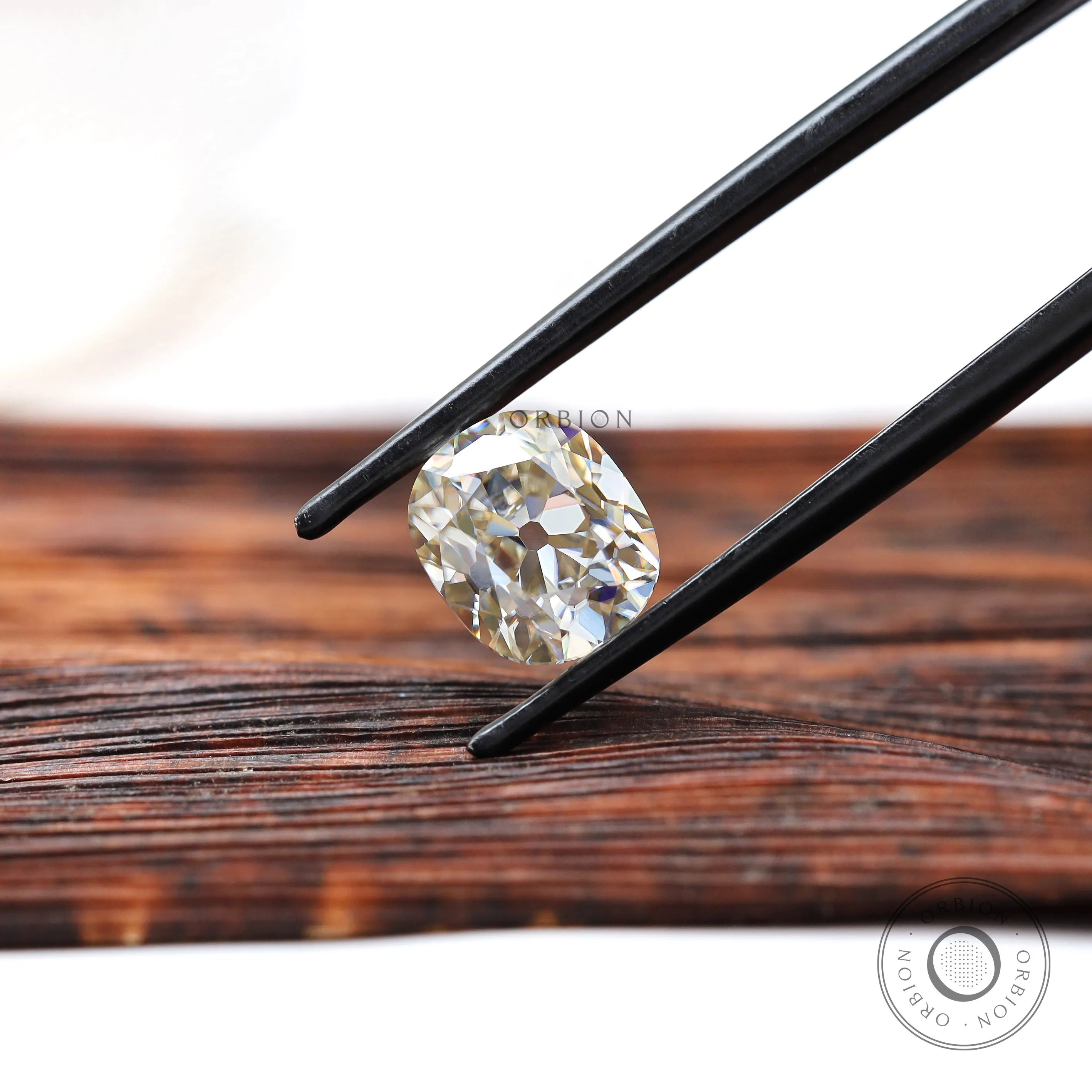 Vintage inspired elongated cushion moissanite stone with warm hue