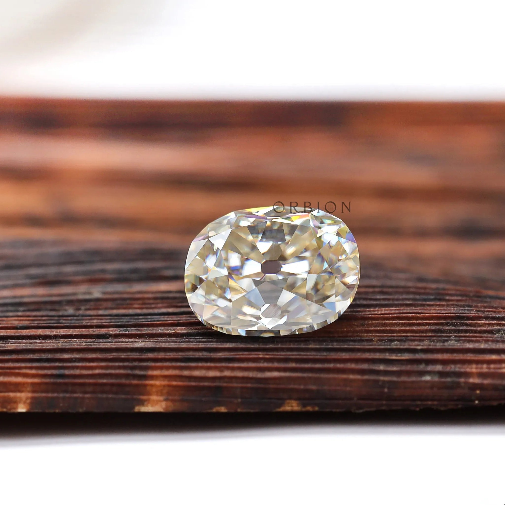 Warm toned elongated cushion moissanite stone for custom jewelry