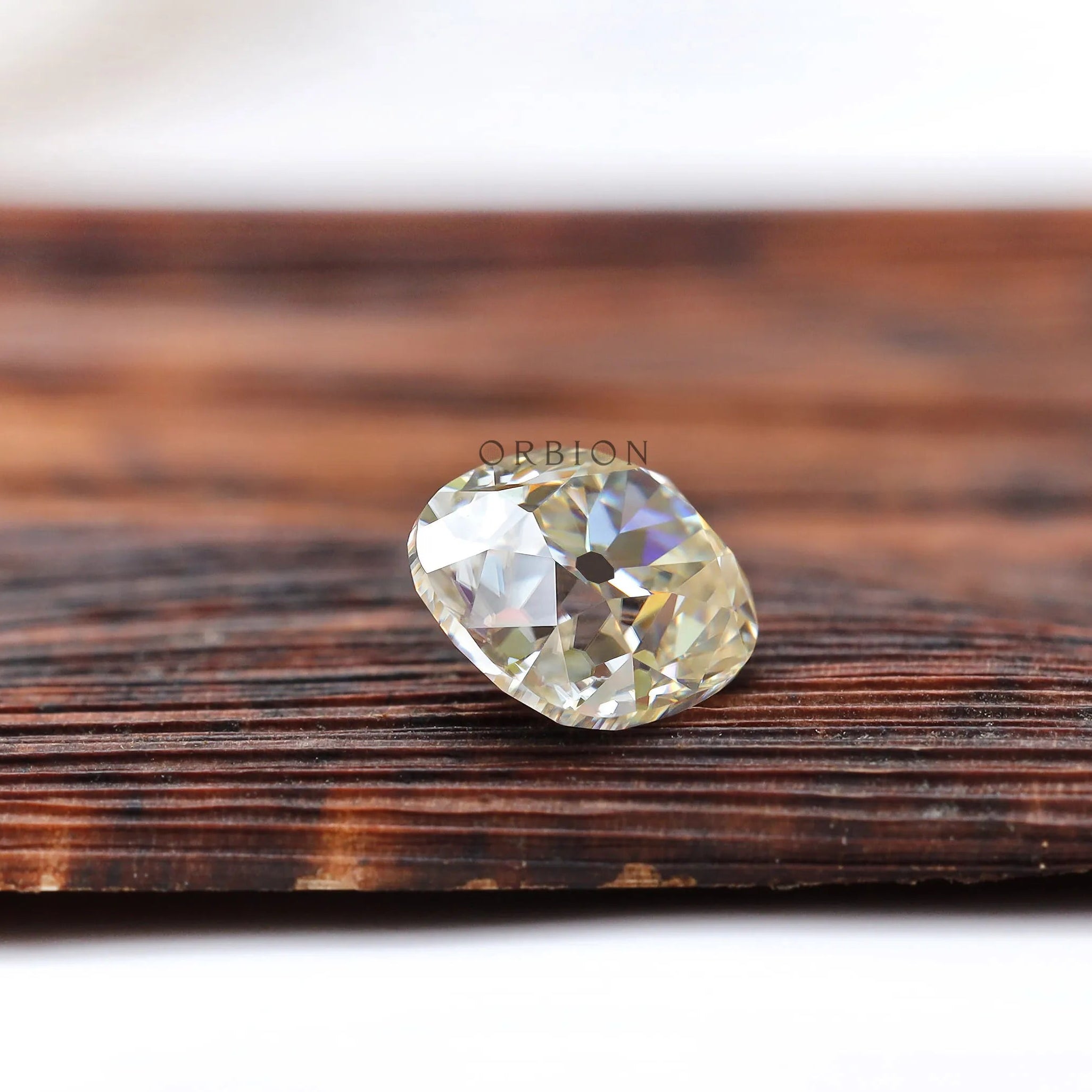 Classic antique cut moissanite elongated cushion in off white shade