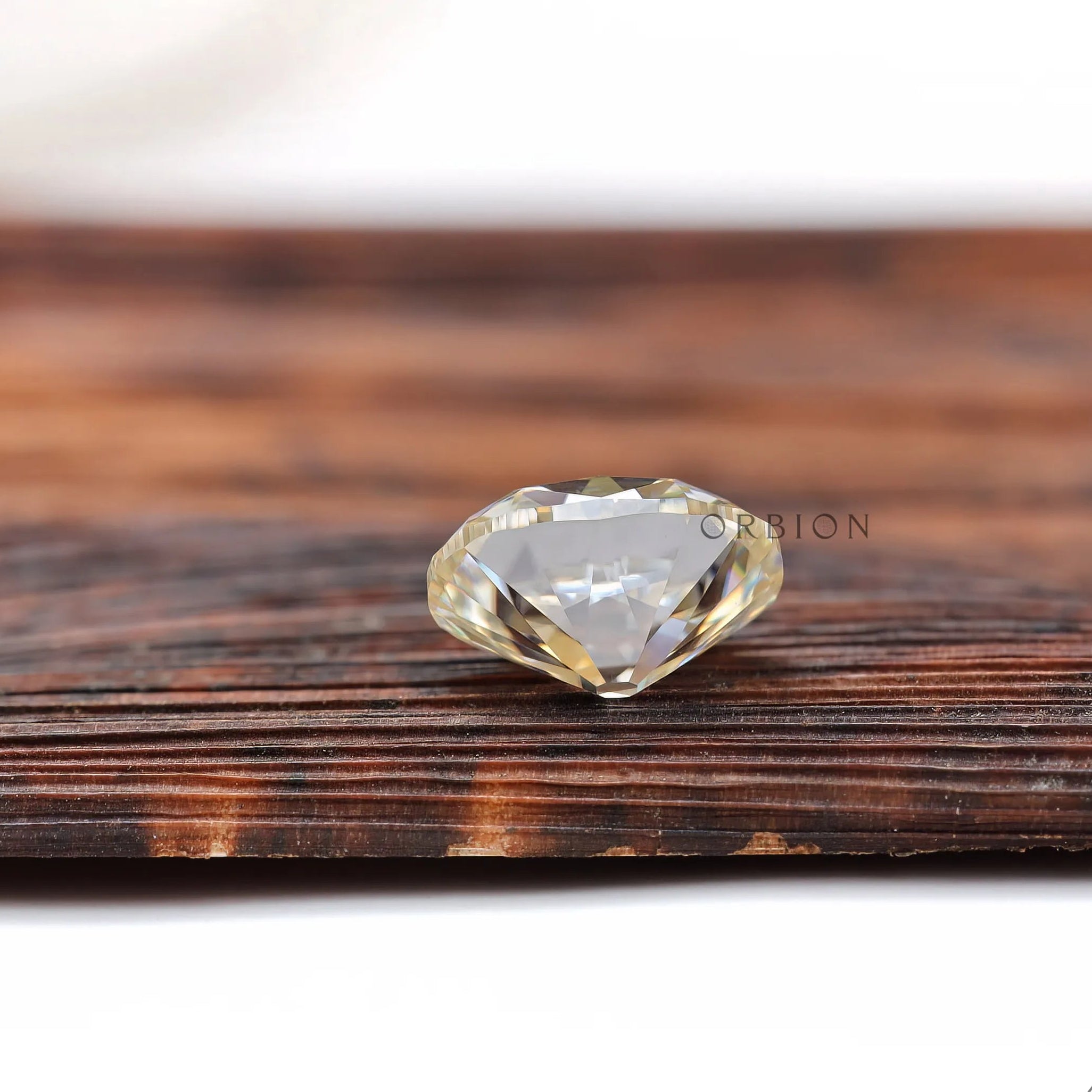 3 ct elongated cushion moissanite with vintage faceting and soft color