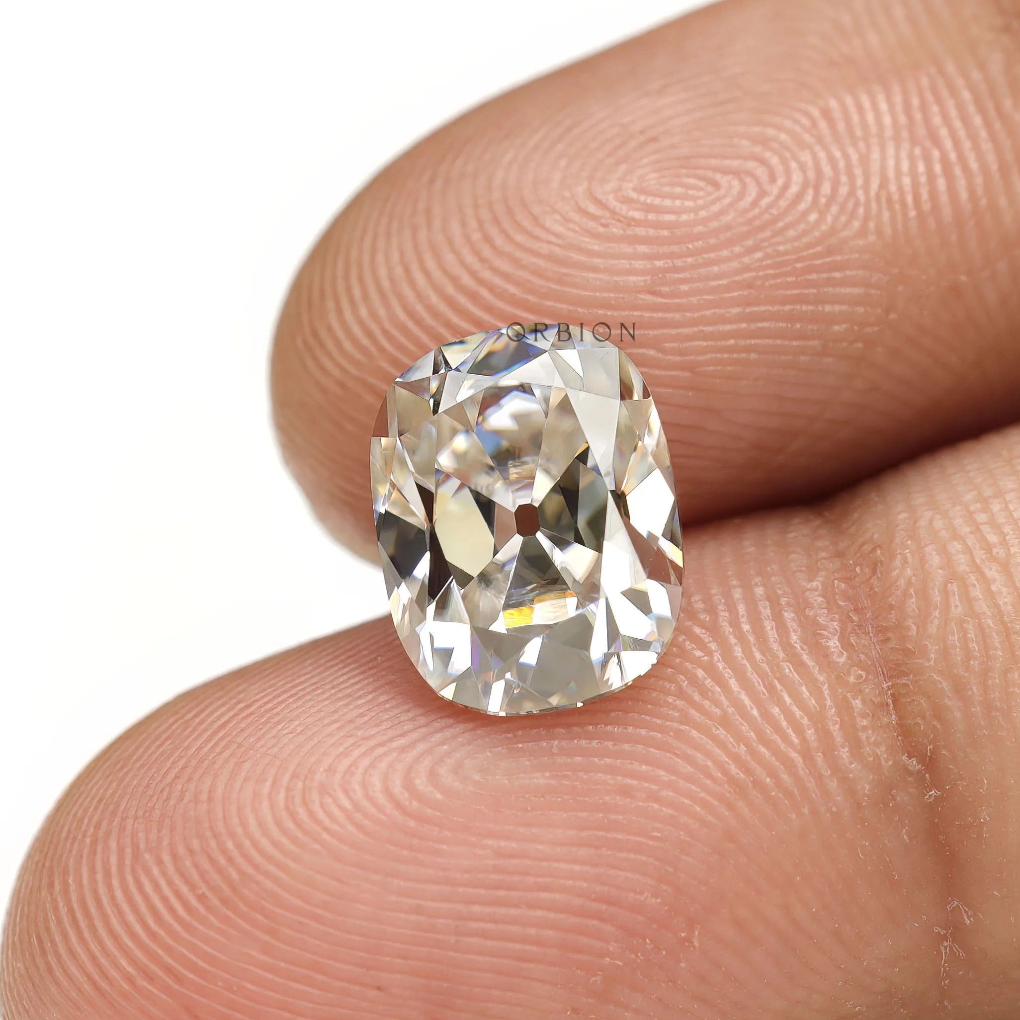 Off white moissanite elongated cushion with vintage old mine faceting