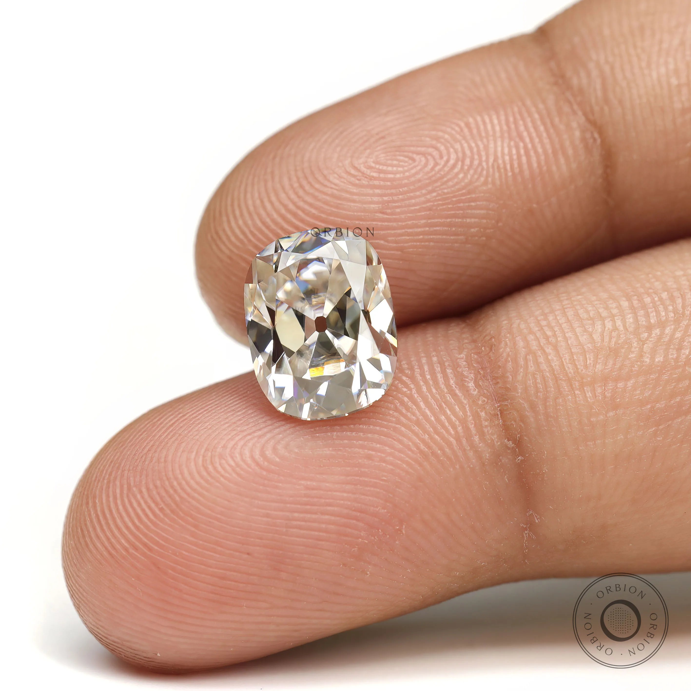 Off white moissanite elongated cushion with vintage old mine faceting