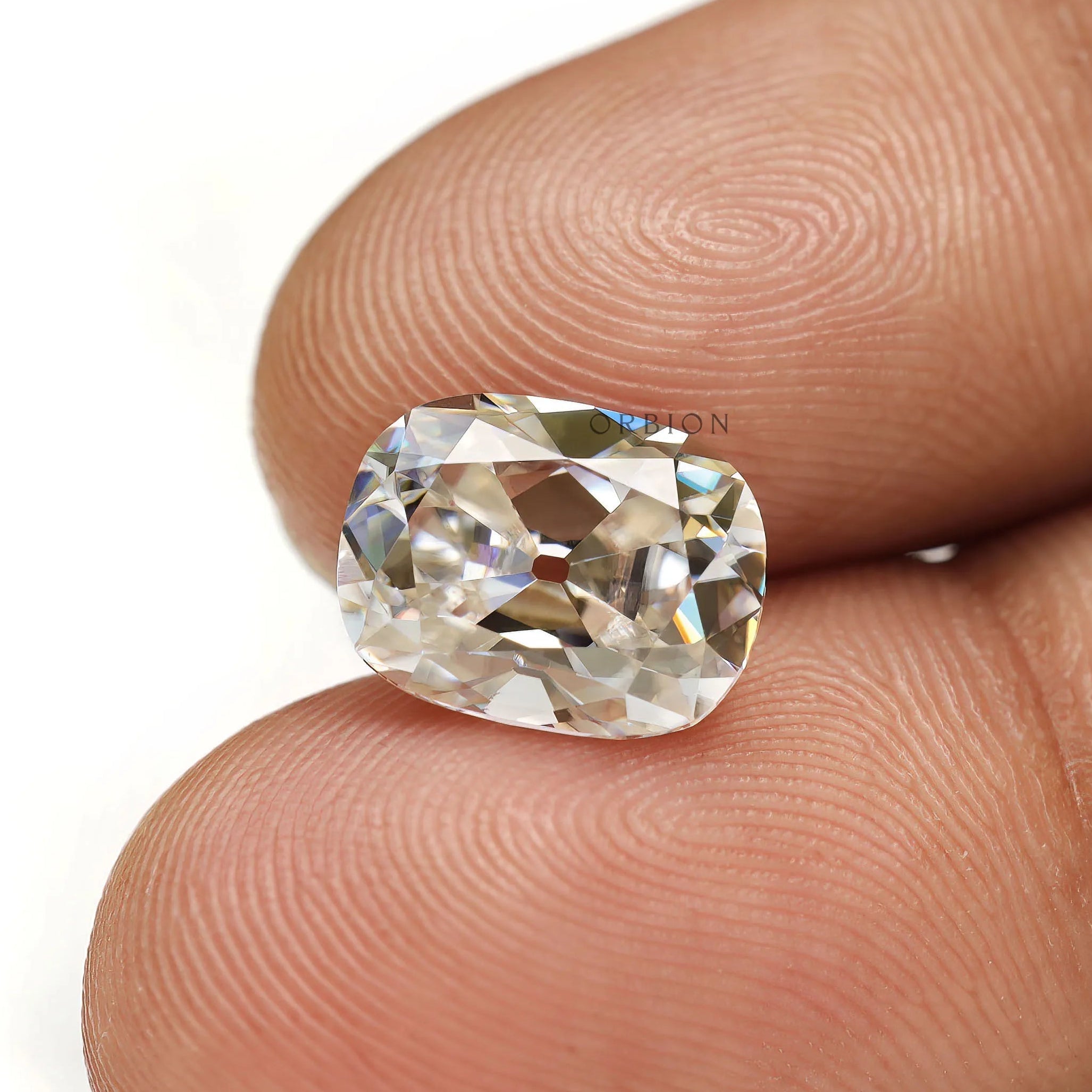 Off white moissanite elongated cushion shape with old mine cut 