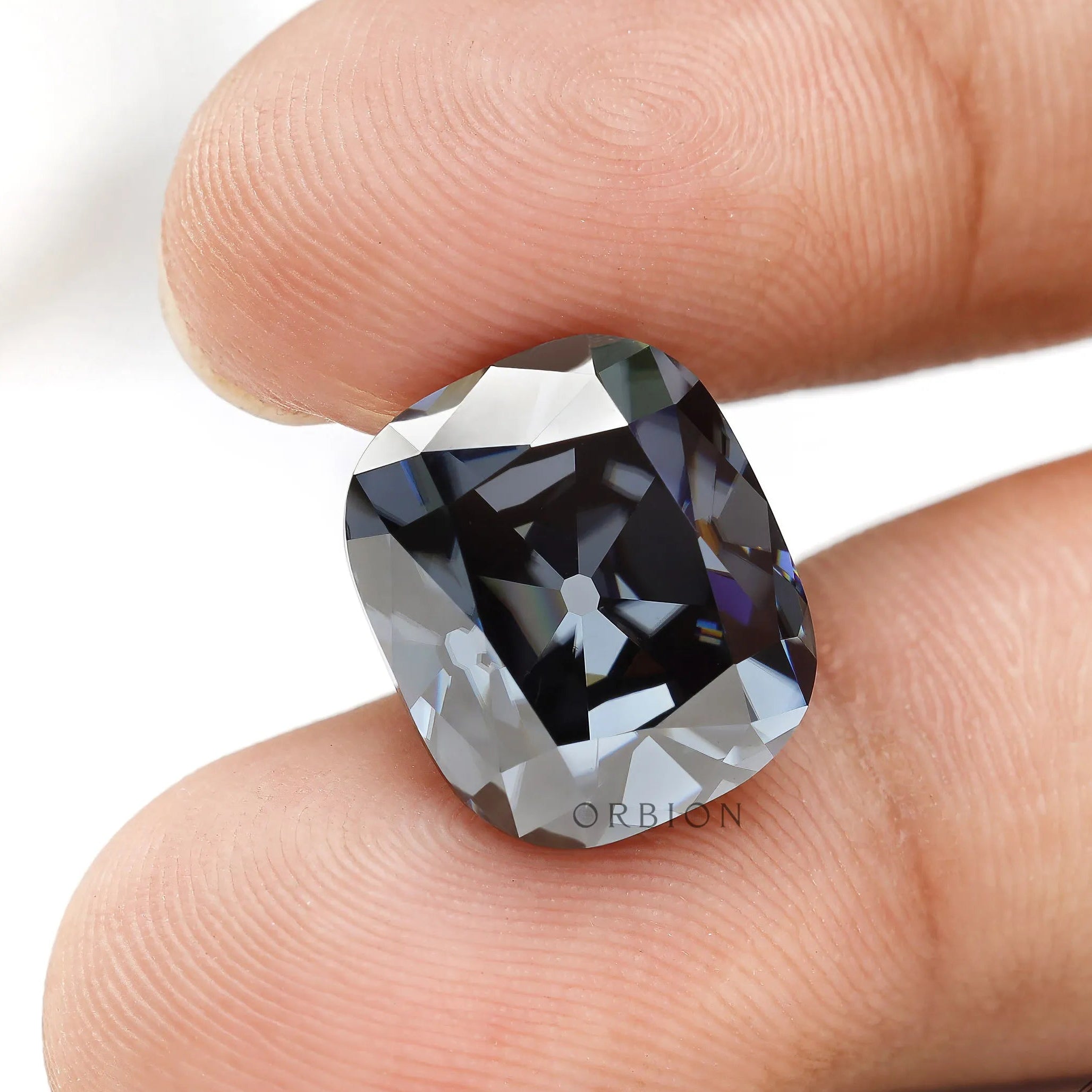 Elongated cushion moissanite with vintage faceting and grey brilliance