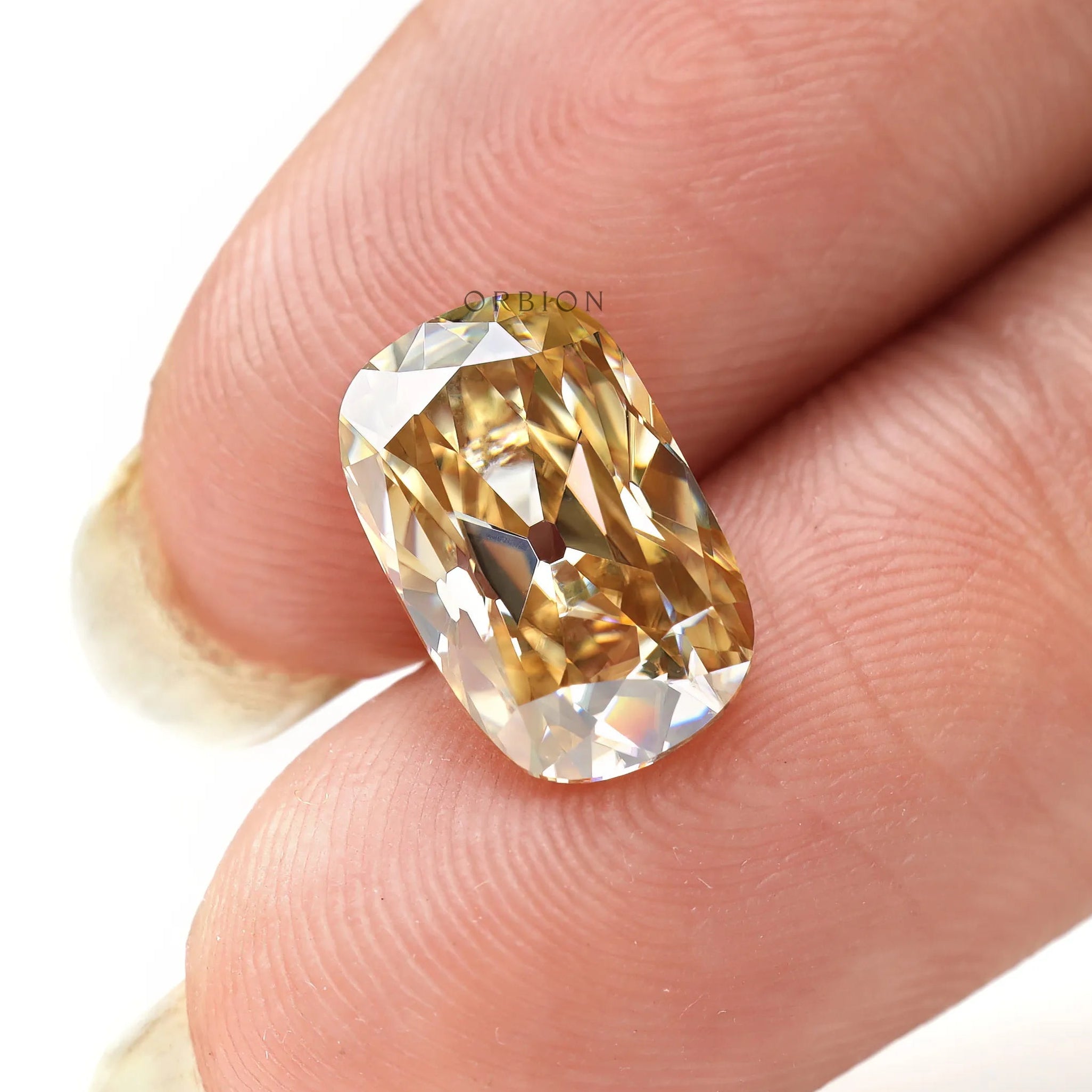 Elongated cushion moissanite warm champagne tones