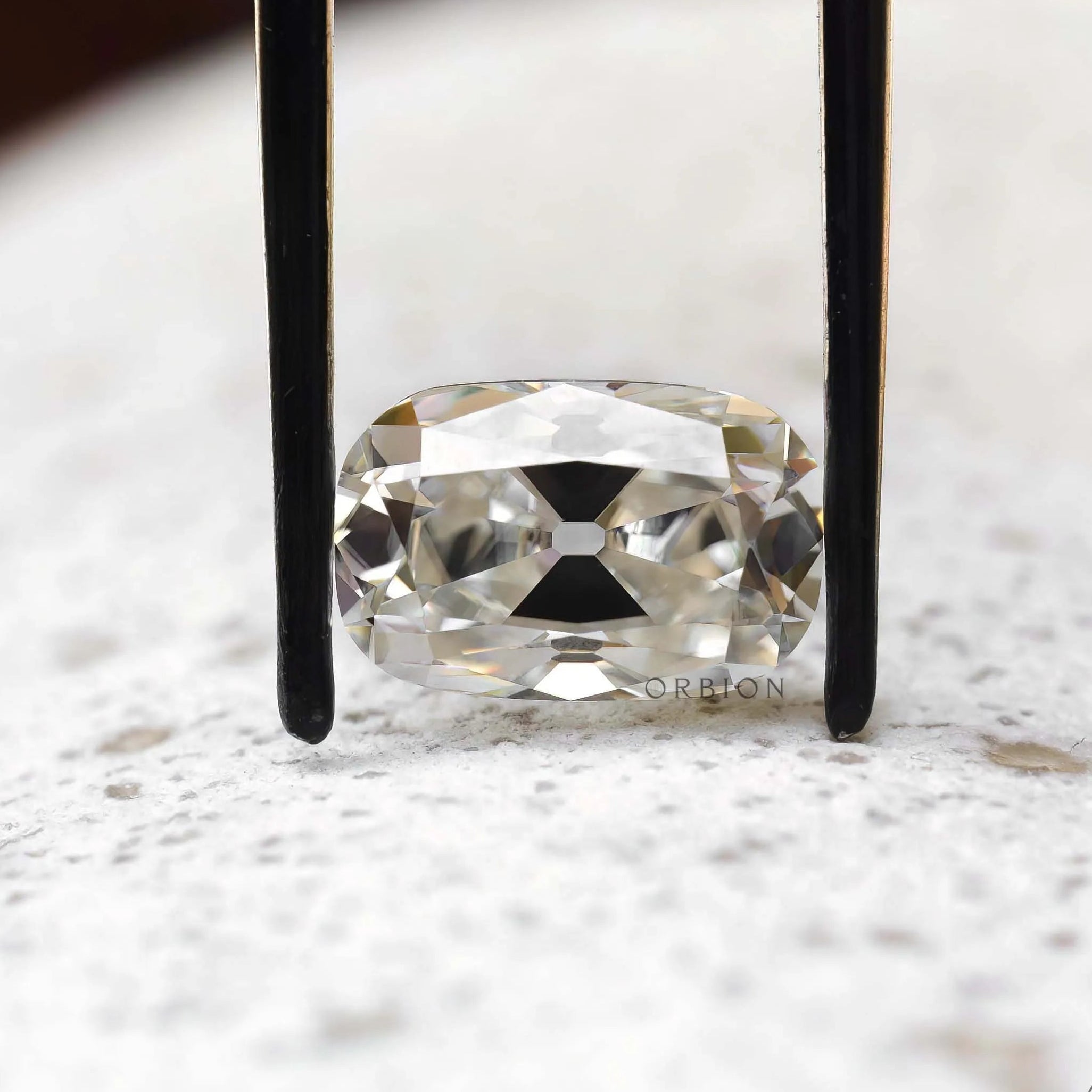 4 ct Moissanite elongated cushion with soft off white tone vintage cut