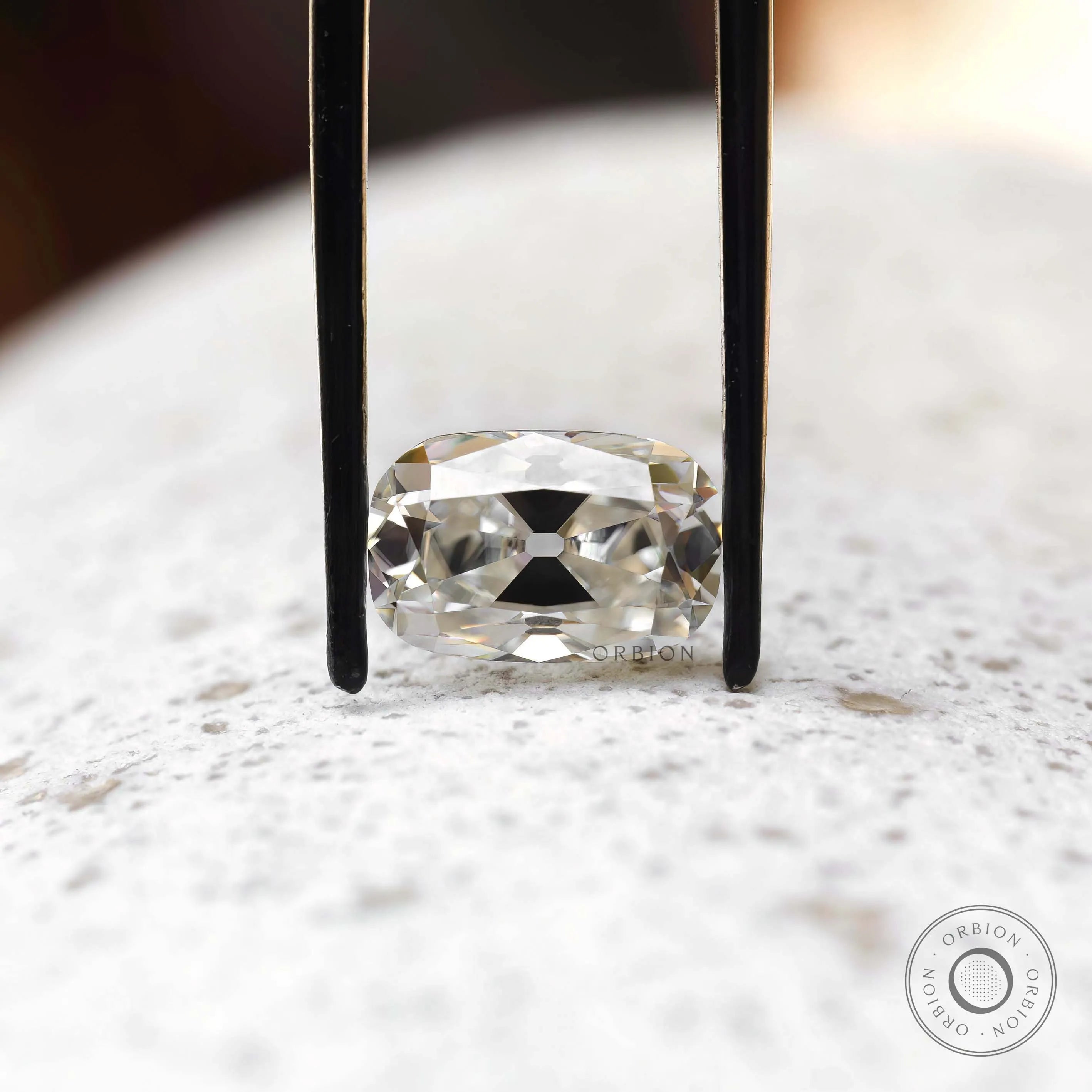 4 ct Moissanite elongated cushion with soft off white tone vintage cut