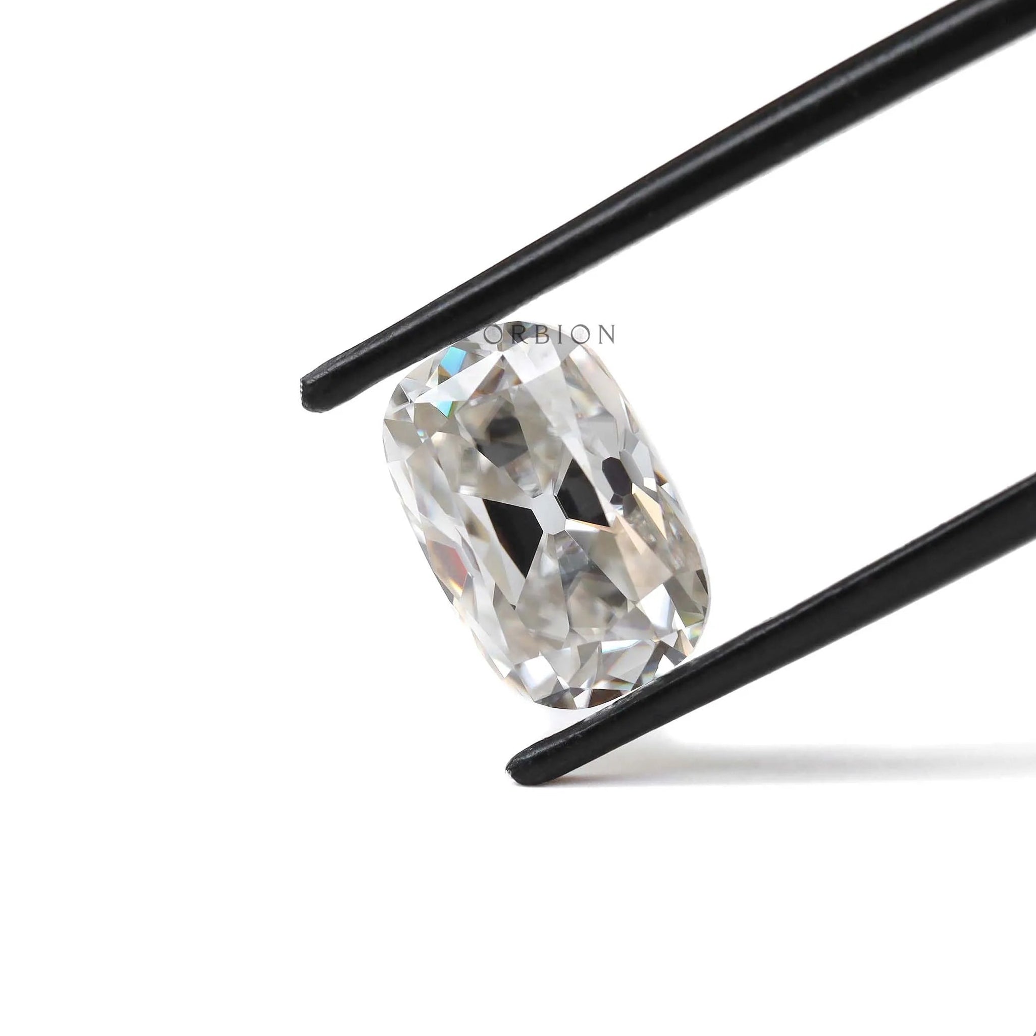 4 ct Elongated cushion moissanite with warm off white hue old mine cut