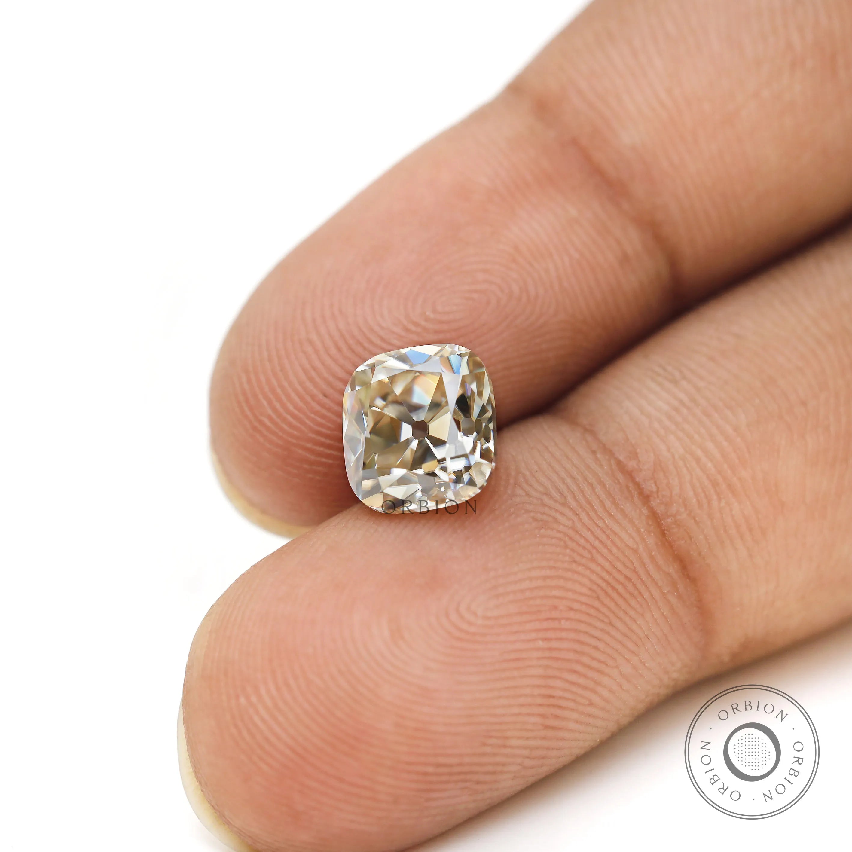 Elongated cushion old mine cut warm color moissanite