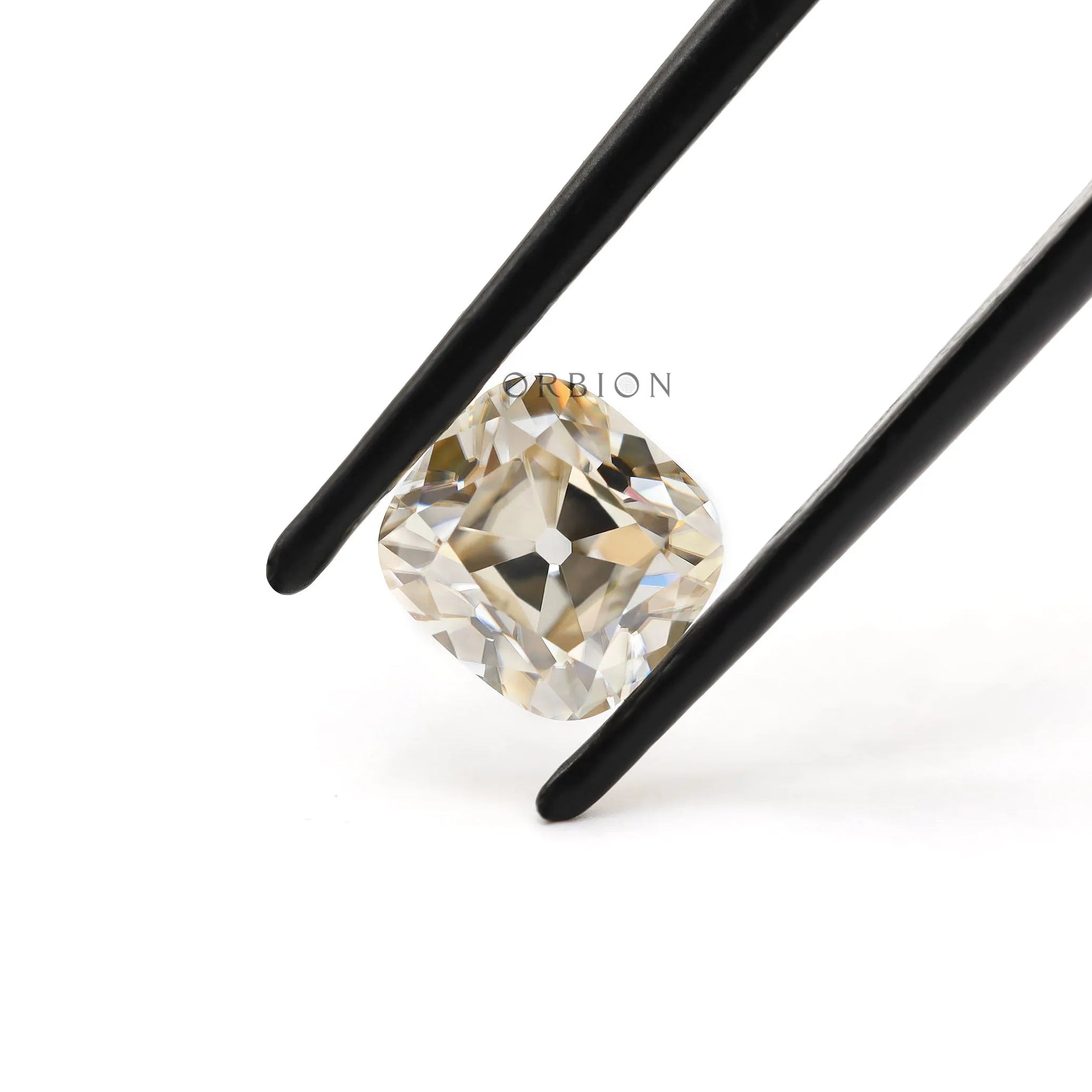 1.70 ct Elongated cushion moissanite with warm off white hue old mine cut